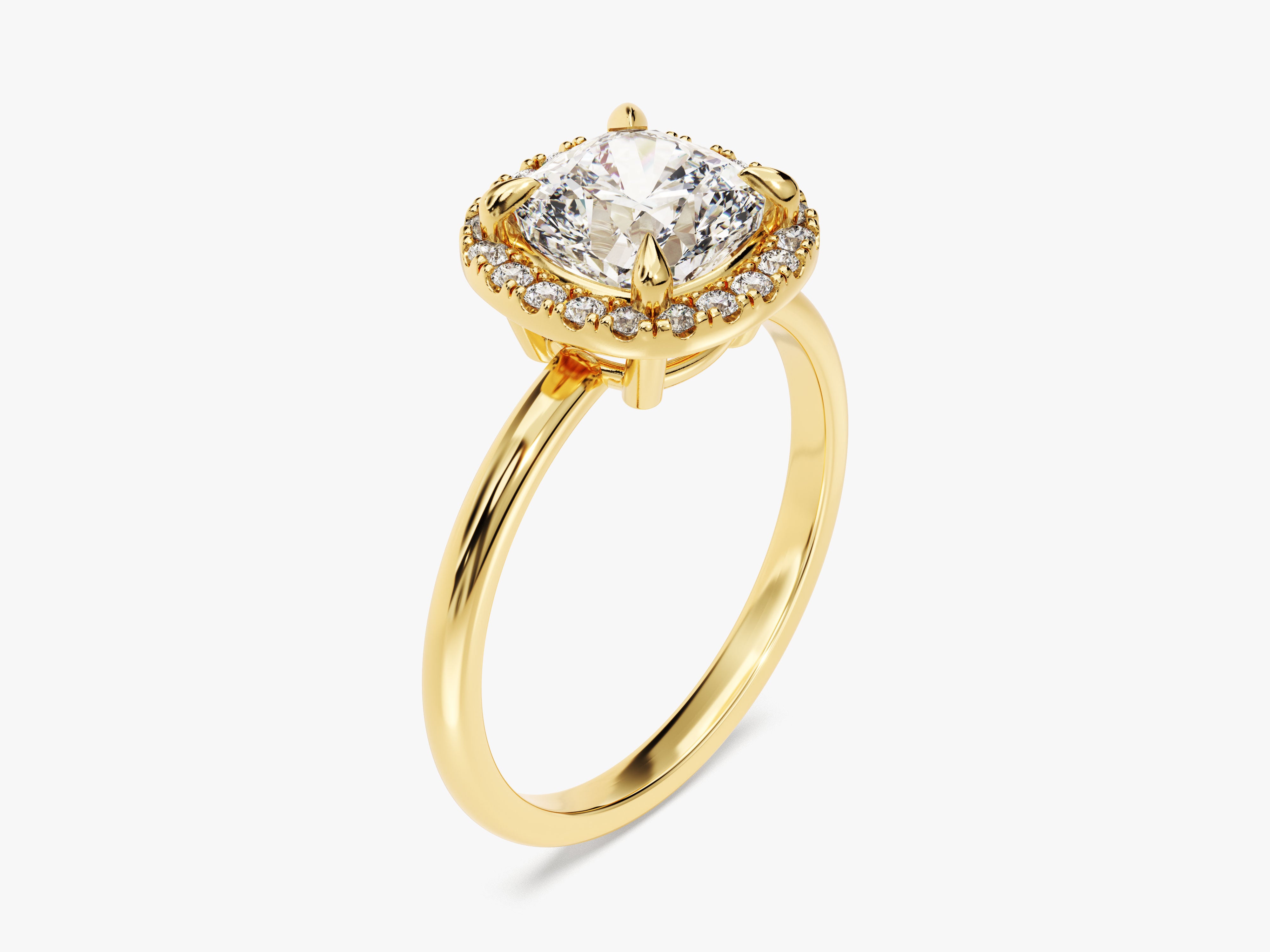 Gold ring with cushion-cut diamond and halo diamonds