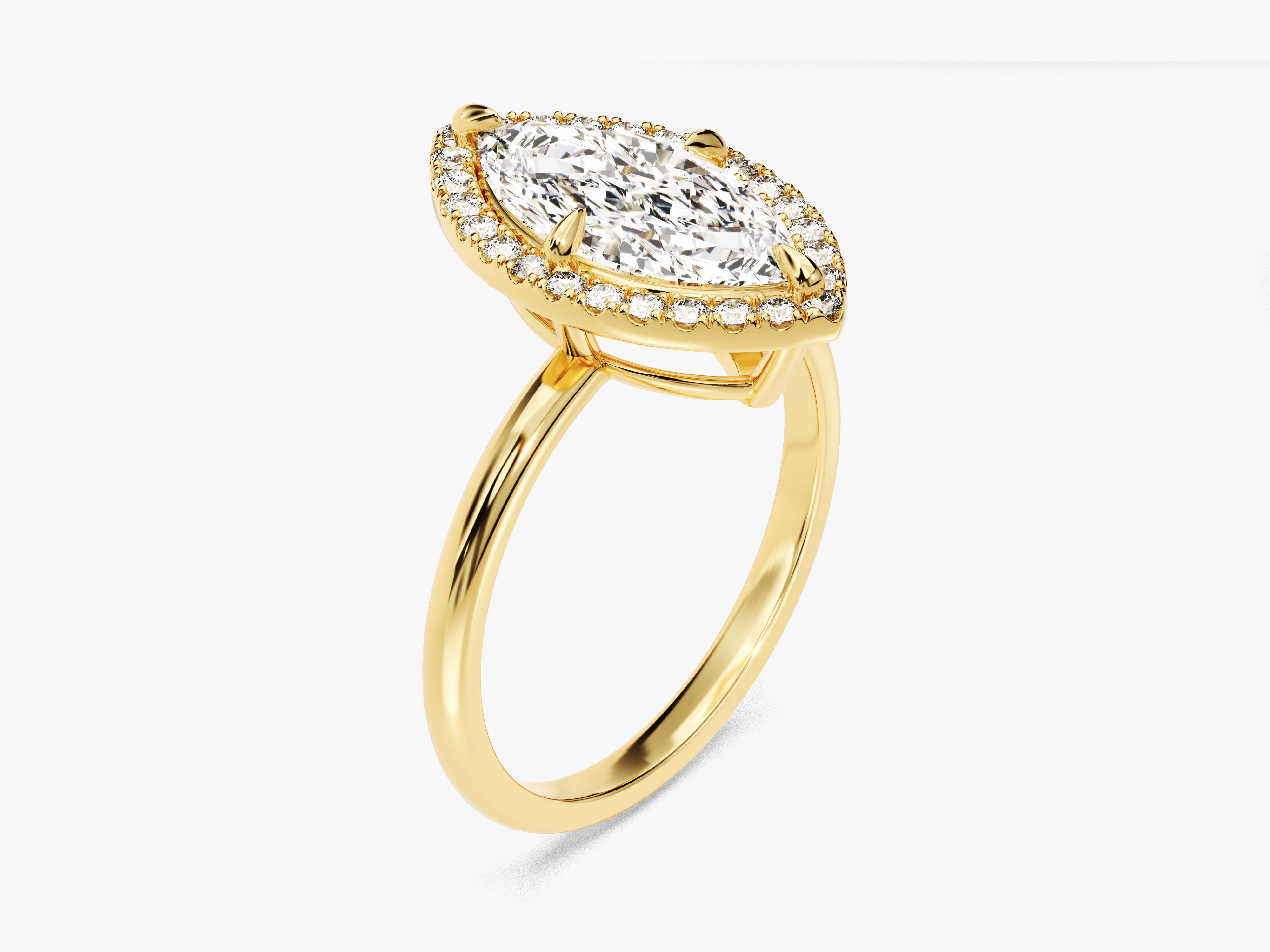 Marquise diamond halo engagement ring in yellow gold