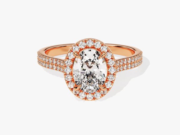 Oval diamond engagement ring with rose gold band and halo
