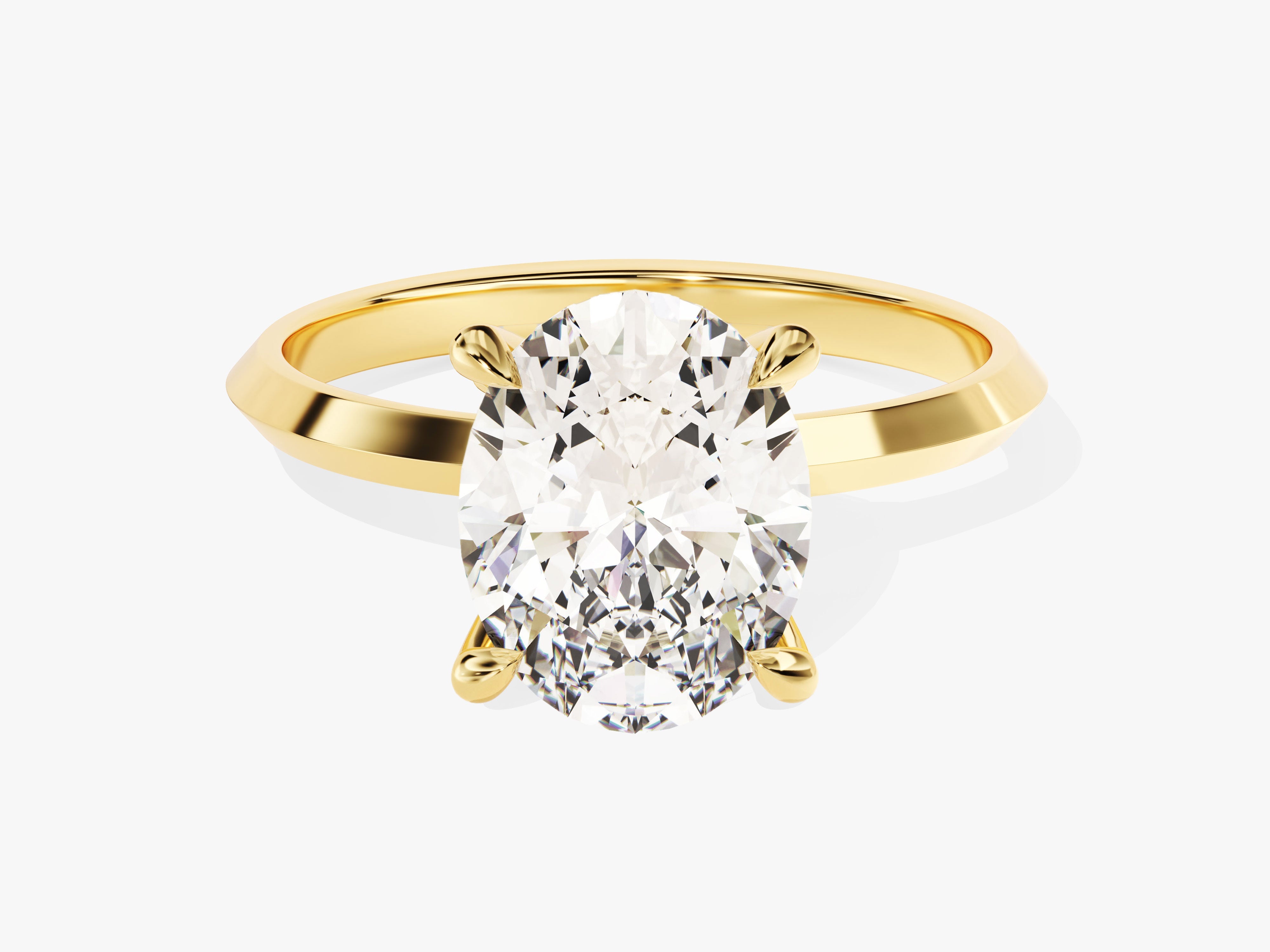 Oval diamond engagement ring in yellow gold setting