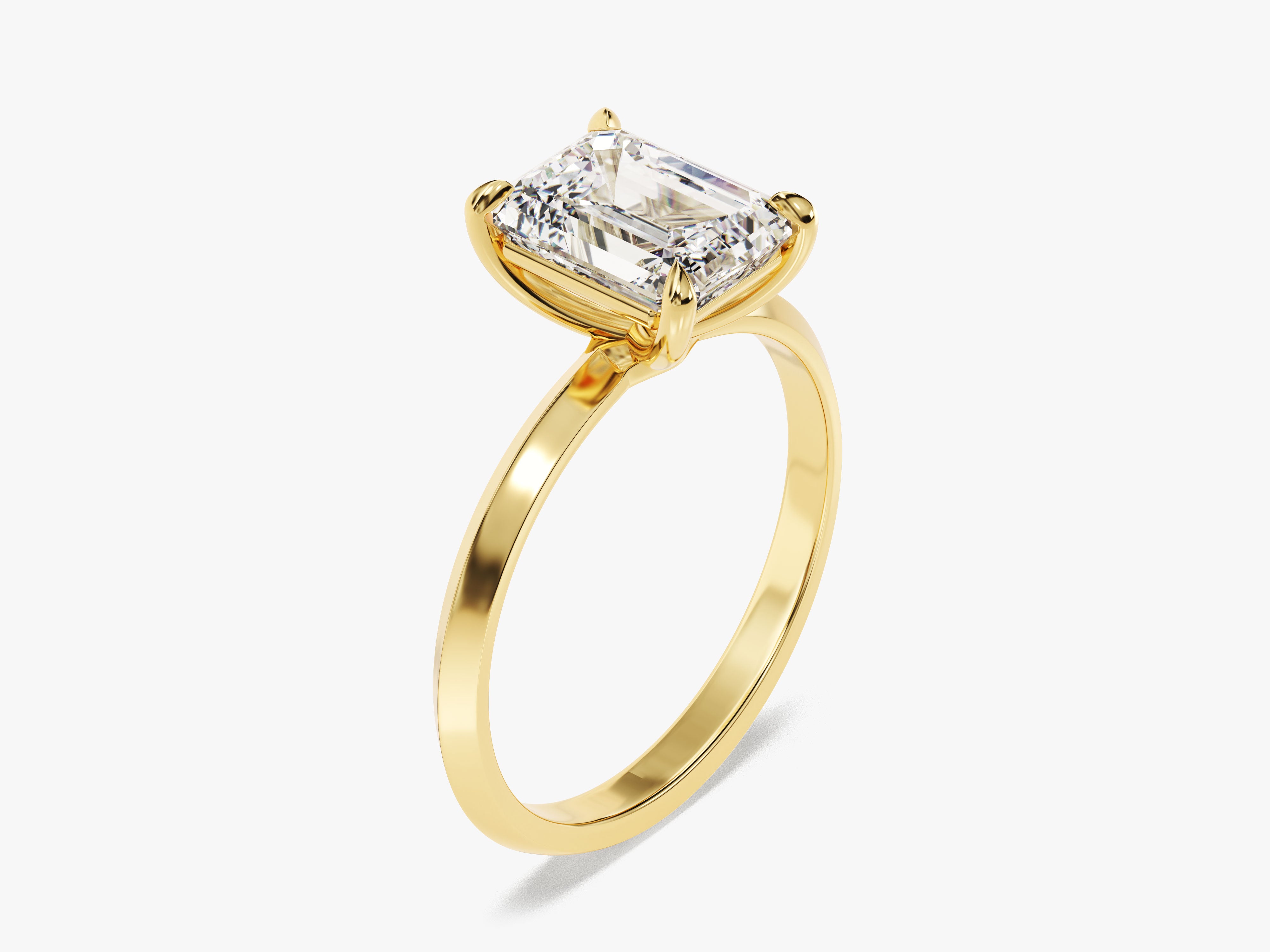 Emerald cut diamond engagement ring in yellow gold