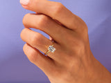 Emerald cut diamond ring on a hand, fine jewelry