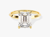 Emerald cut diamond ring in yellow gold setting