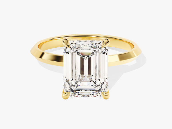 Emerald cut diamond ring in yellow gold setting