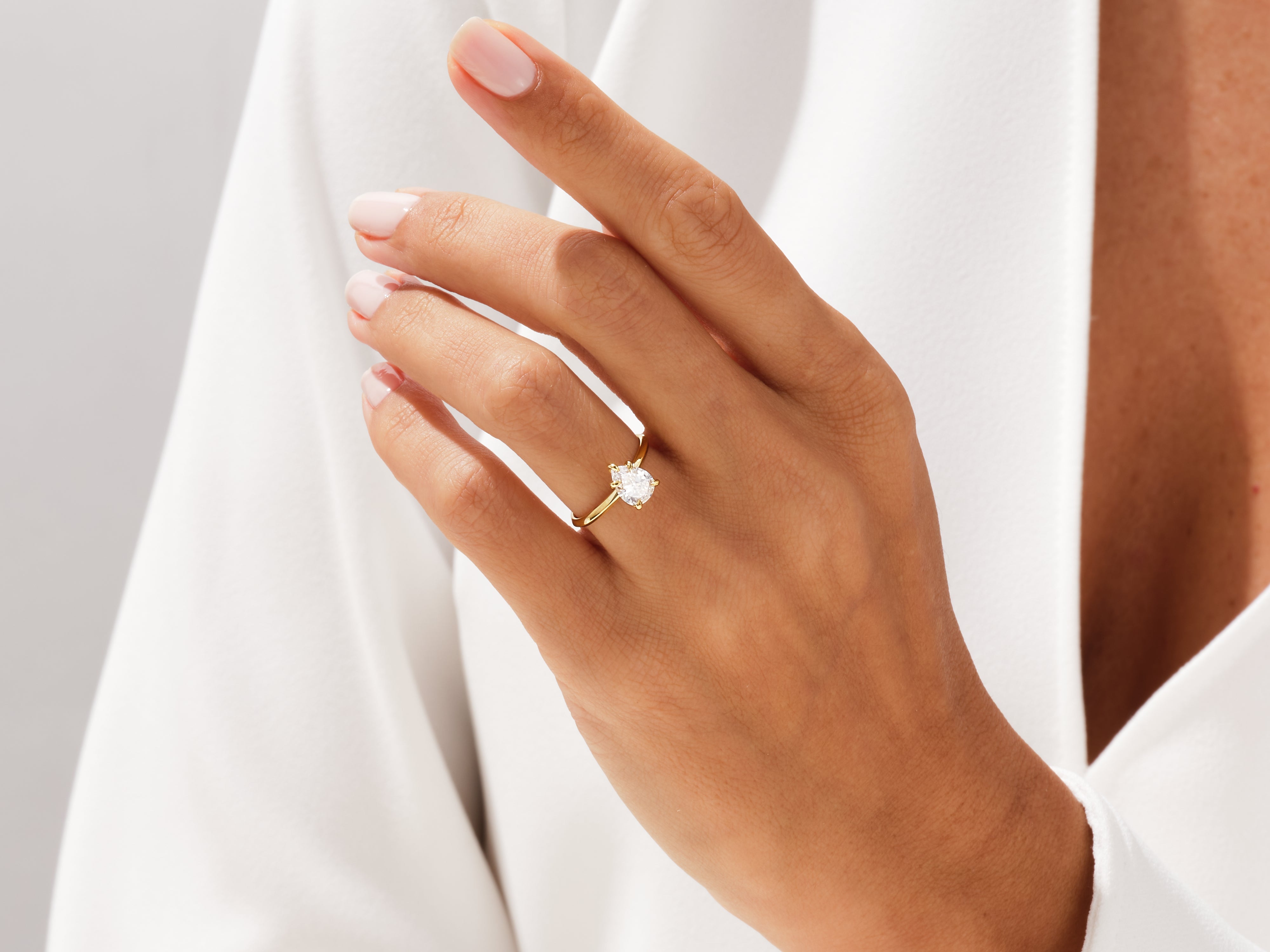 Diamond engagement ring on a woman's hand, jewelry photography