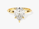 Gold ring with pear-shaped diamond engagement ring