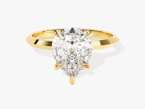 Gold ring with pear-shaped diamond engagement ring