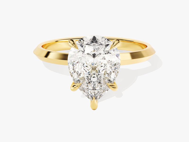 Gold ring with pear-shaped diamond engagement ring