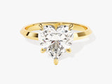 Gold ring with a heart-shaped diamond engagement ring