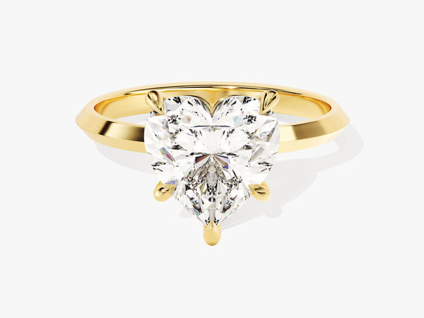 Gold ring with a heart-shaped diamond engagement ring