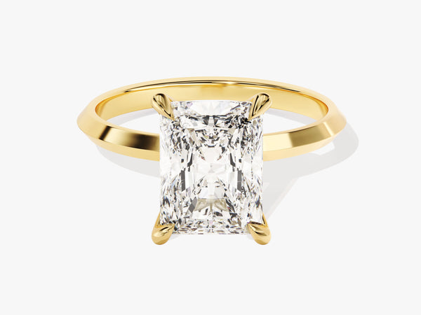 Radiant cut diamond engagement ring in yellow gold setting