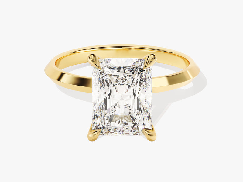 Radiant cut diamond engagement ring in yellow gold setting