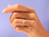Gold ring with square diamond on hand