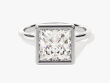 Princess cut diamond engagement ring in a bezel setting