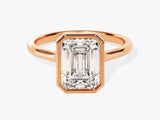 Emerald cut diamond ring in rose gold bezel setting
