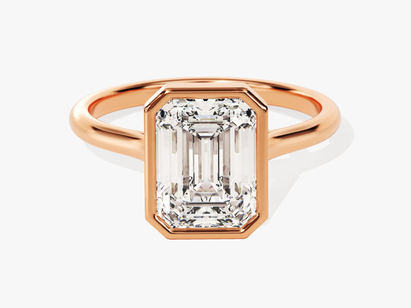 Emerald cut diamond ring in rose gold bezel setting