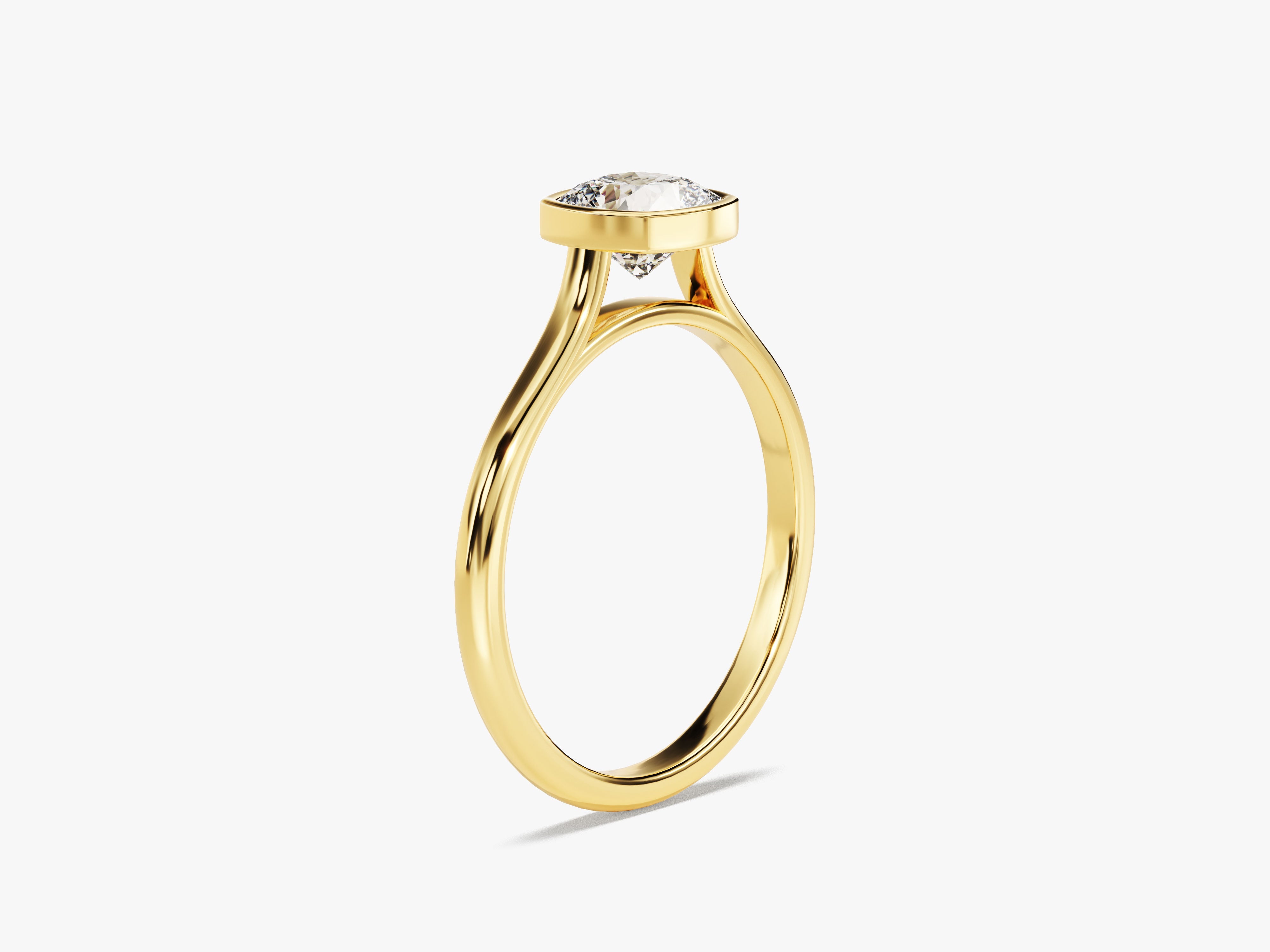 Gold ring with a bezel-set diamond, elegant jewelry design