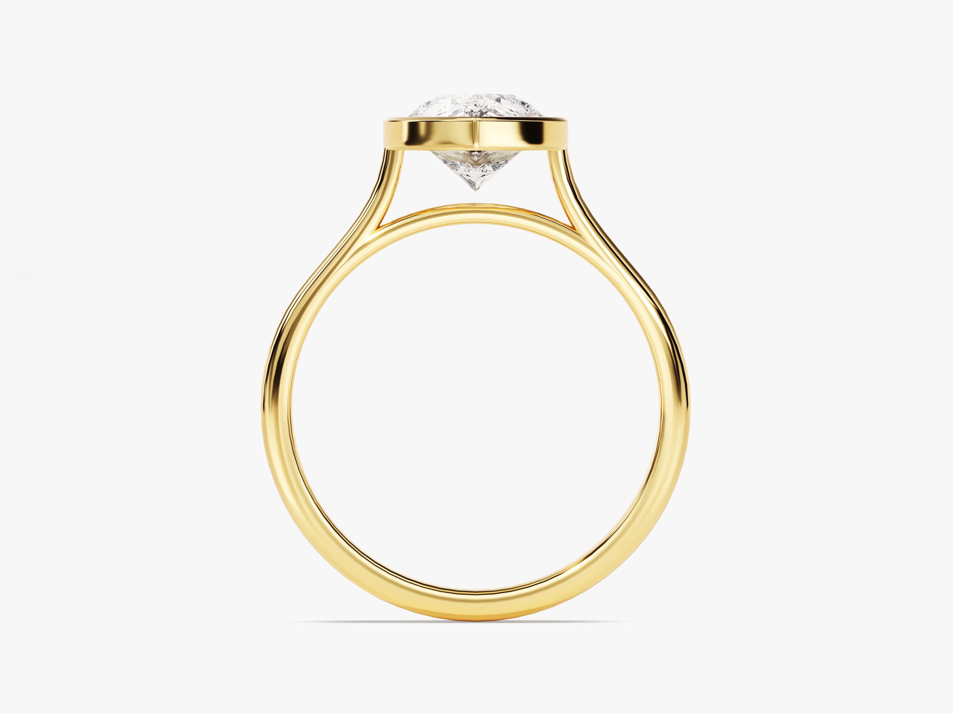 Gold engagement ring with a bezel-set diamond