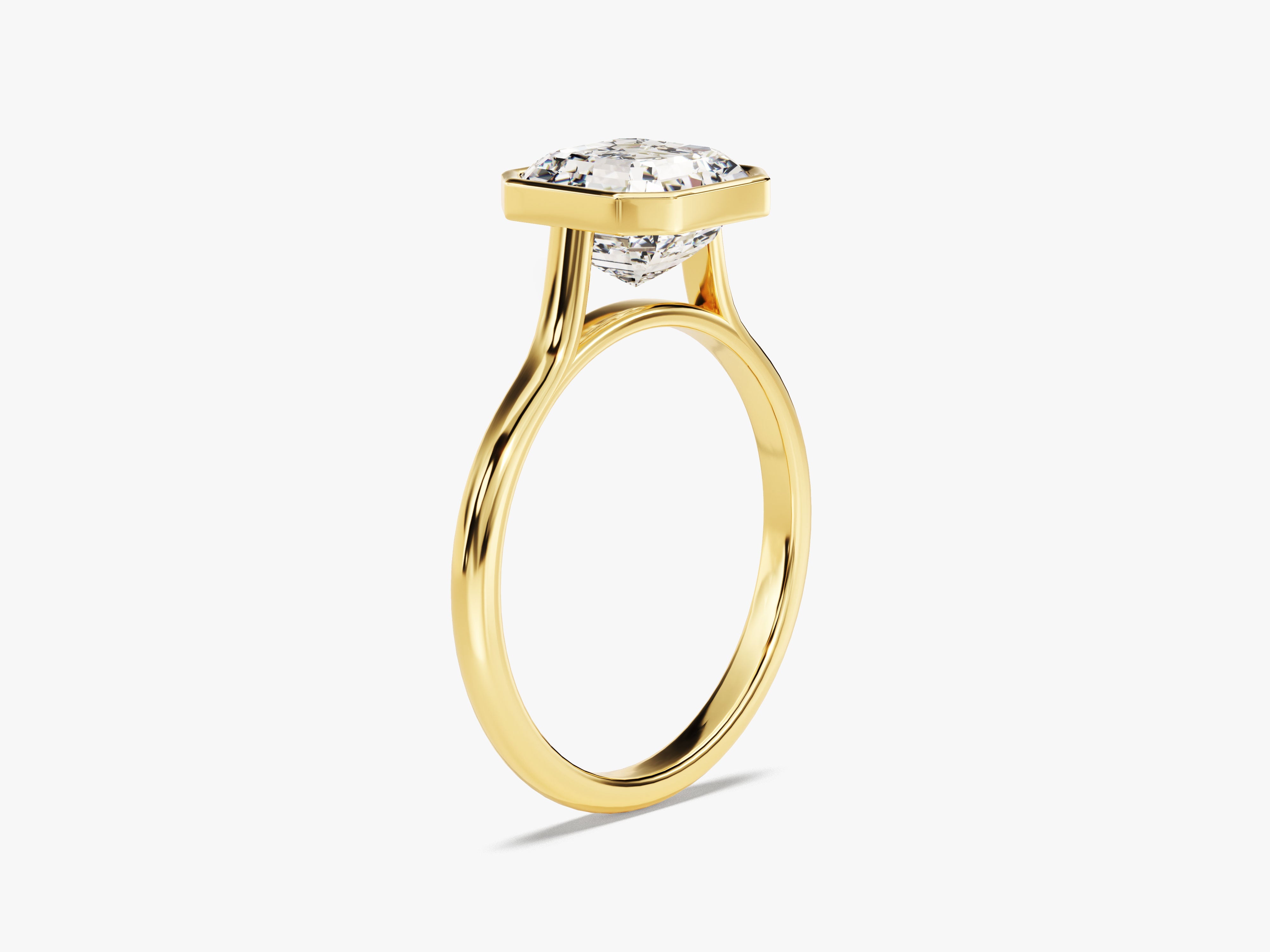 Gold ring with a square-cut diamond bezel setting