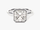 Emerald cut diamond ring in a bezel setting