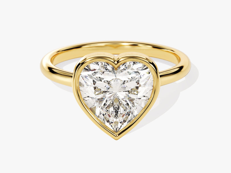 Gold ring with a heart-shaped diamond engagement ring