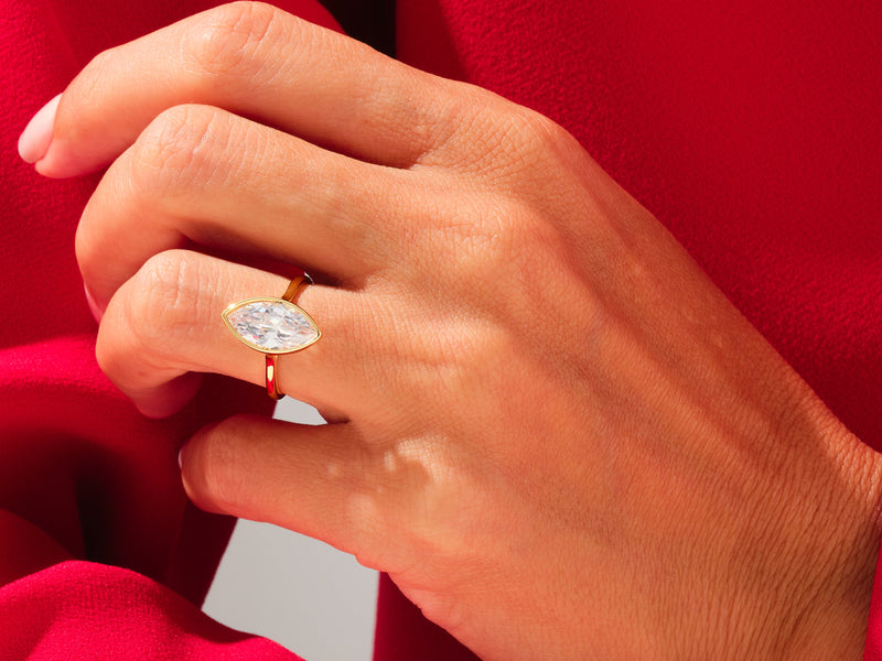 Marquise diamond engagement ring on a hand