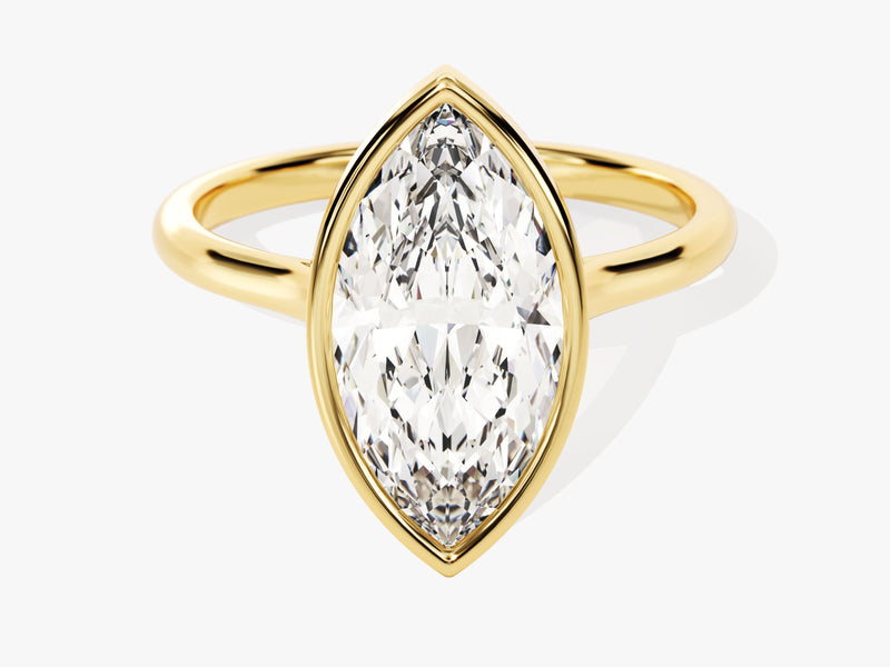 Marquise diamond engagement ring in gold bezel setting