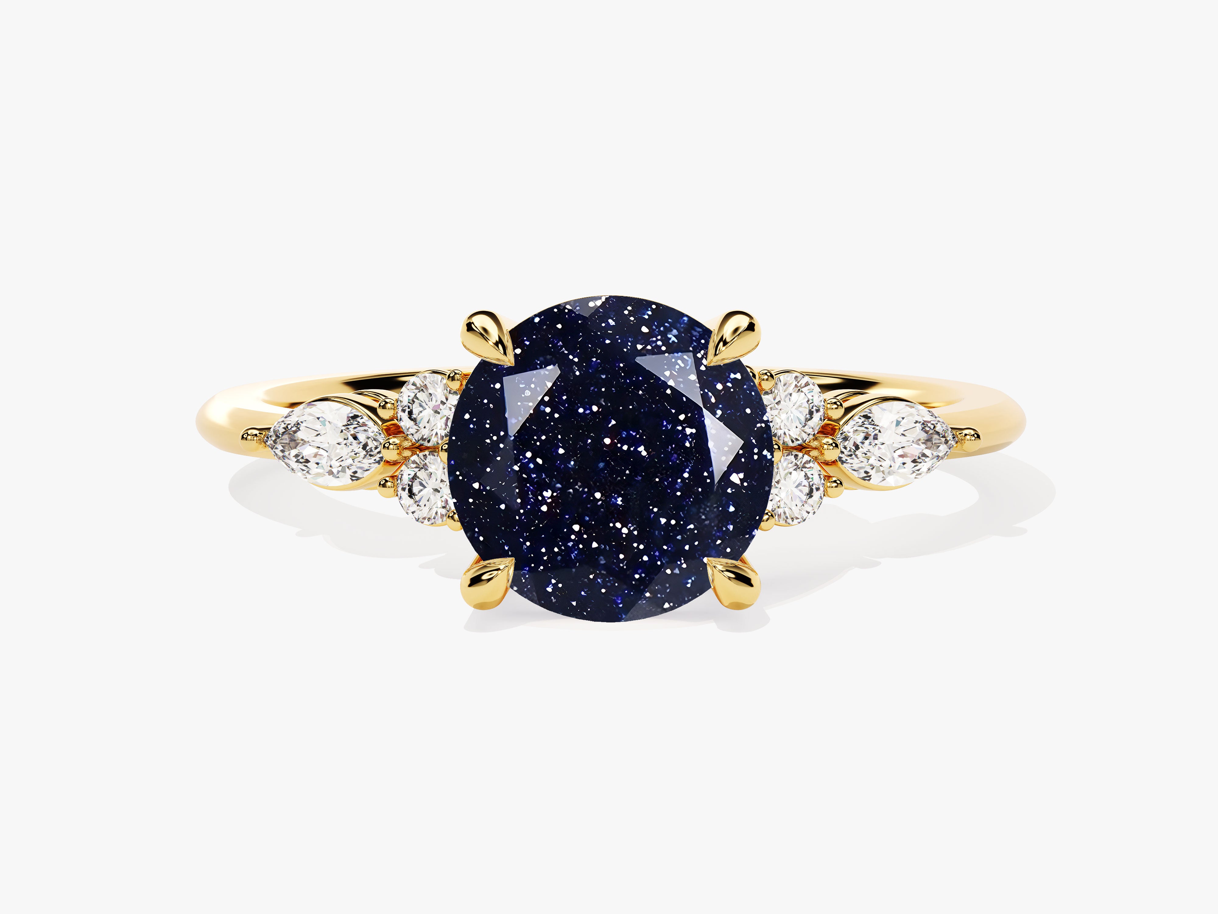 Gold ring with oval blue sandstone and diamond accents