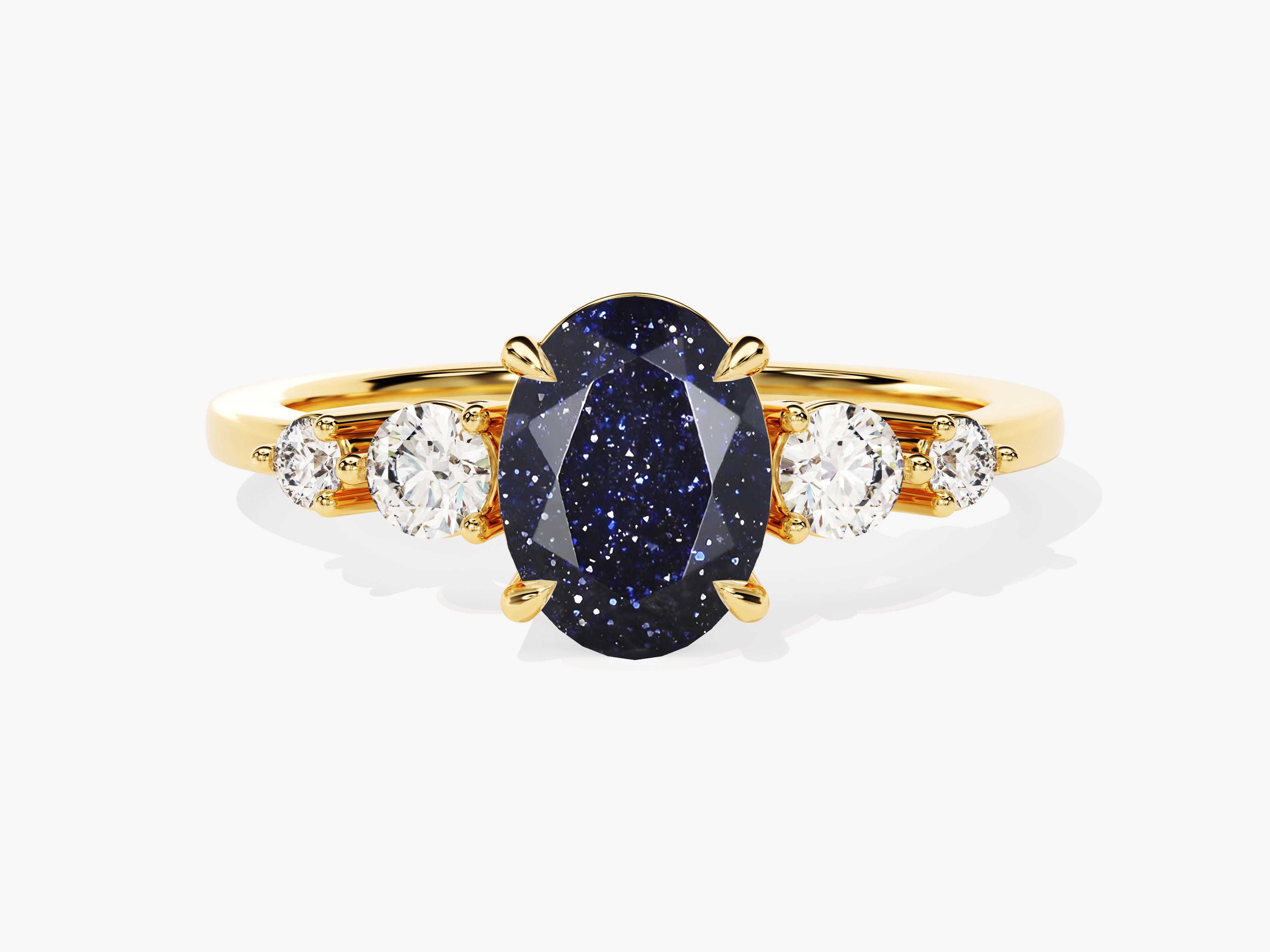 Gold ring with oval blue sandstone and diamonds