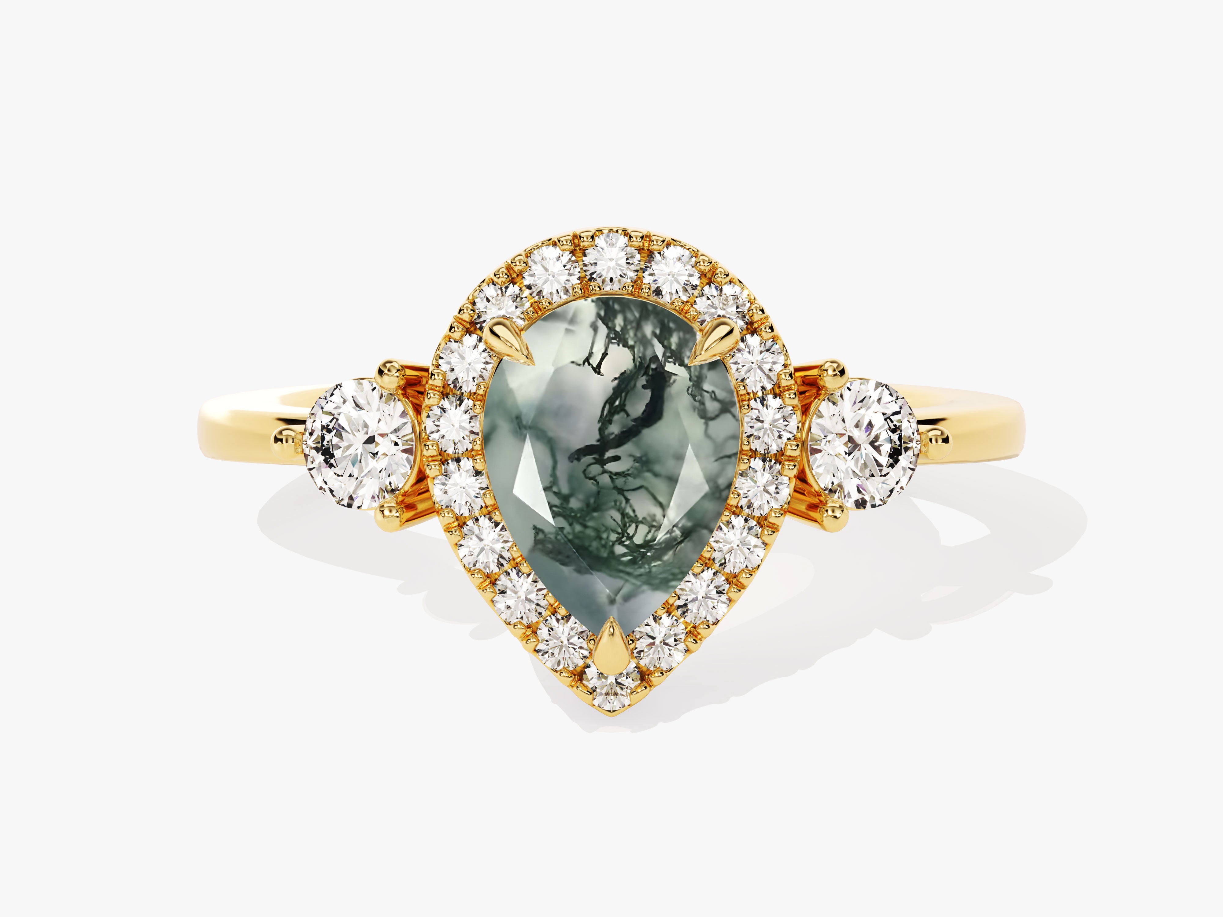 Gold ring with pear-shaped moss agate and diamond halo