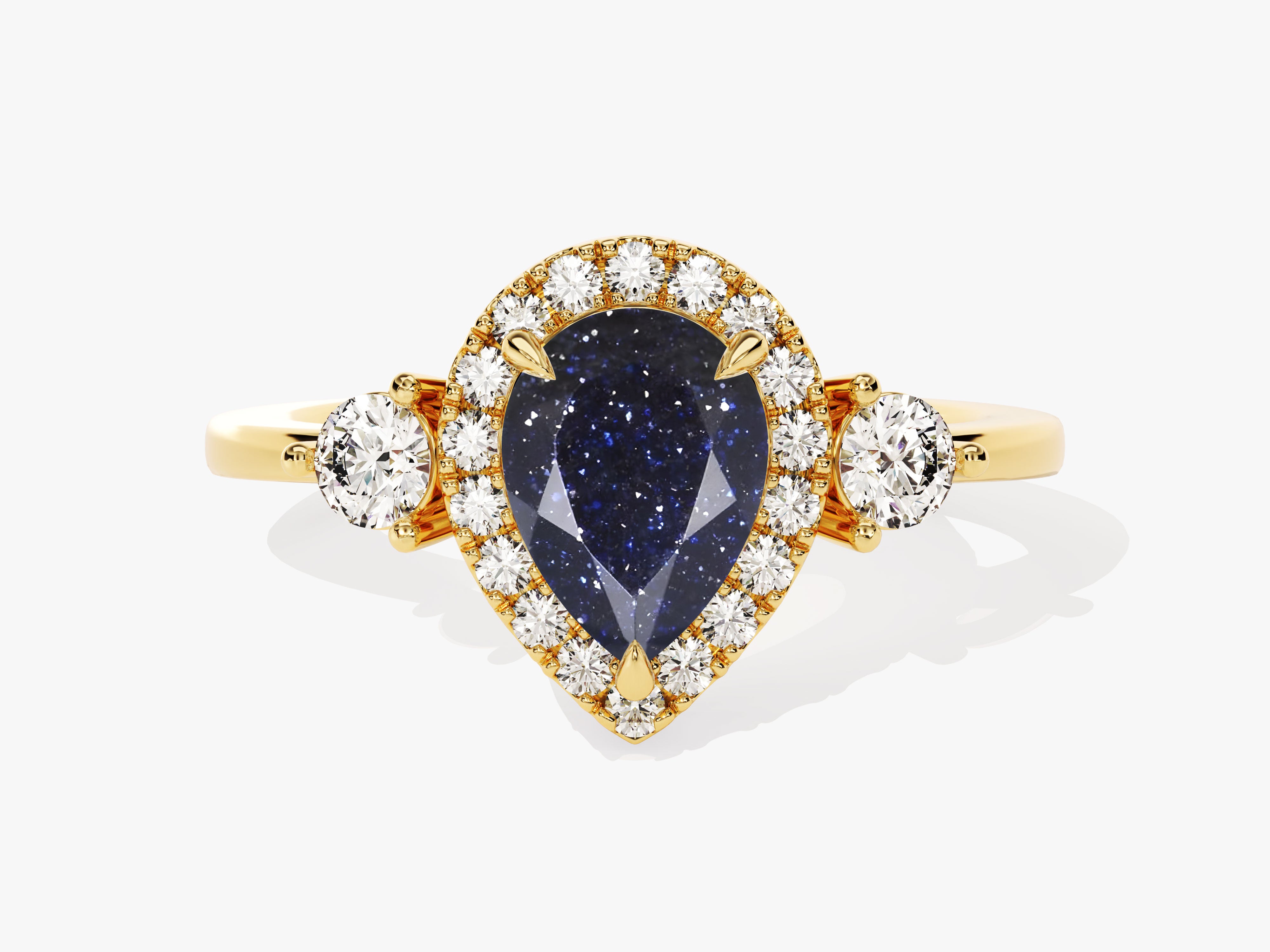 Gold ring with pear-shaped blue gemstone and diamonds