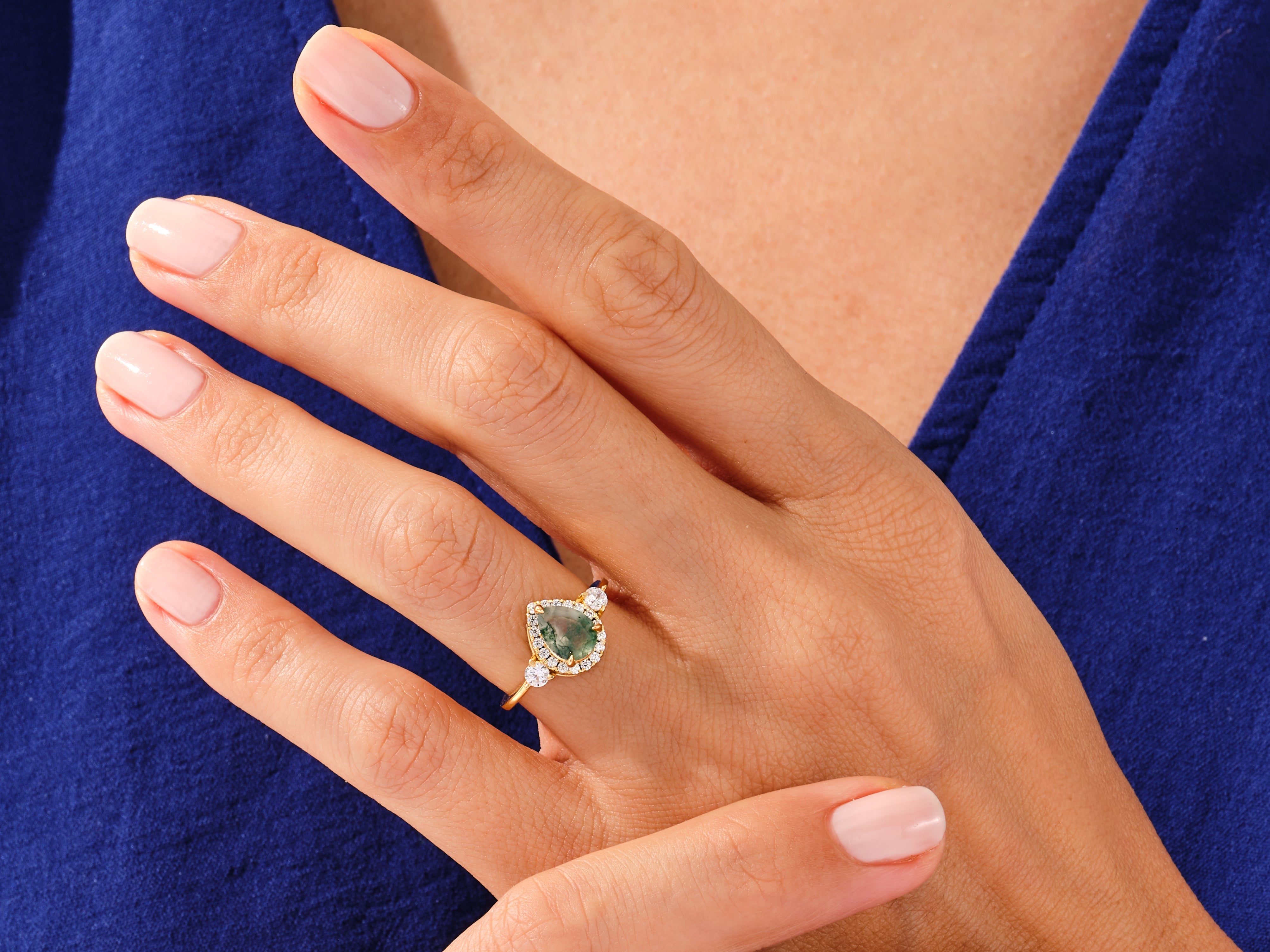 Gold pear-shaped moss agate ring with diamonds