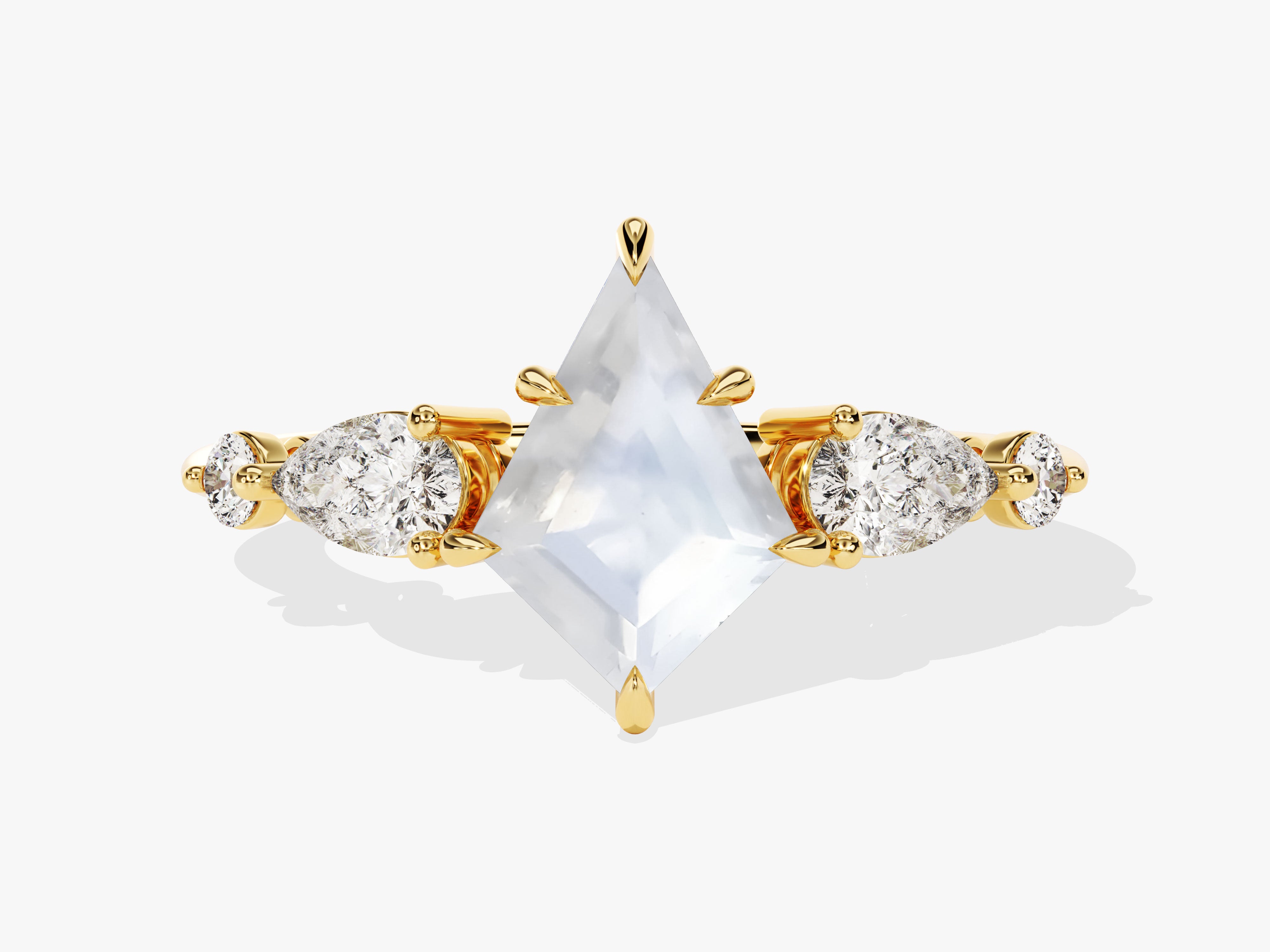 Gold ring with kite-cut diamond and pear-shaped diamonds