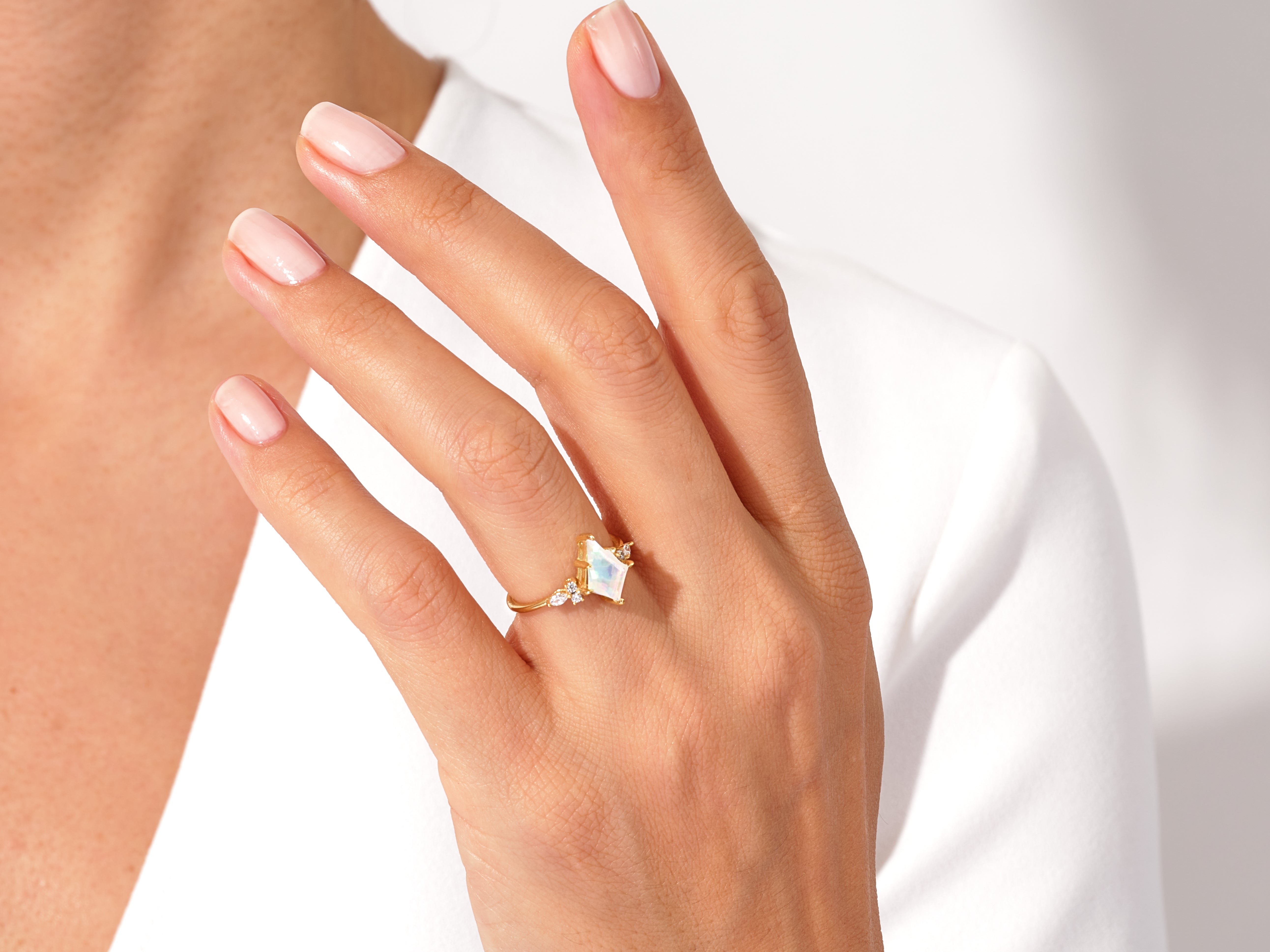 Gold ring with opal and diamond gemstone jewelry