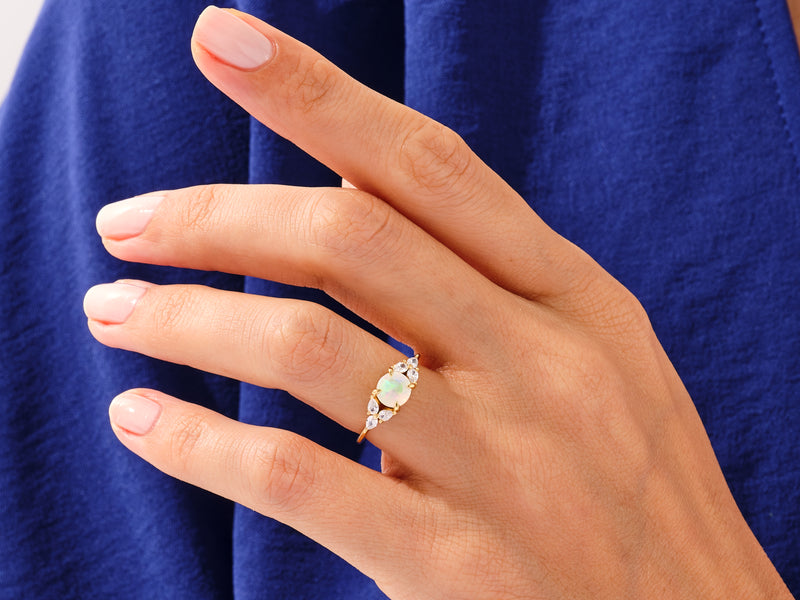 Round Moonstone Engagement Ring with Pear Moissanite Sidestones