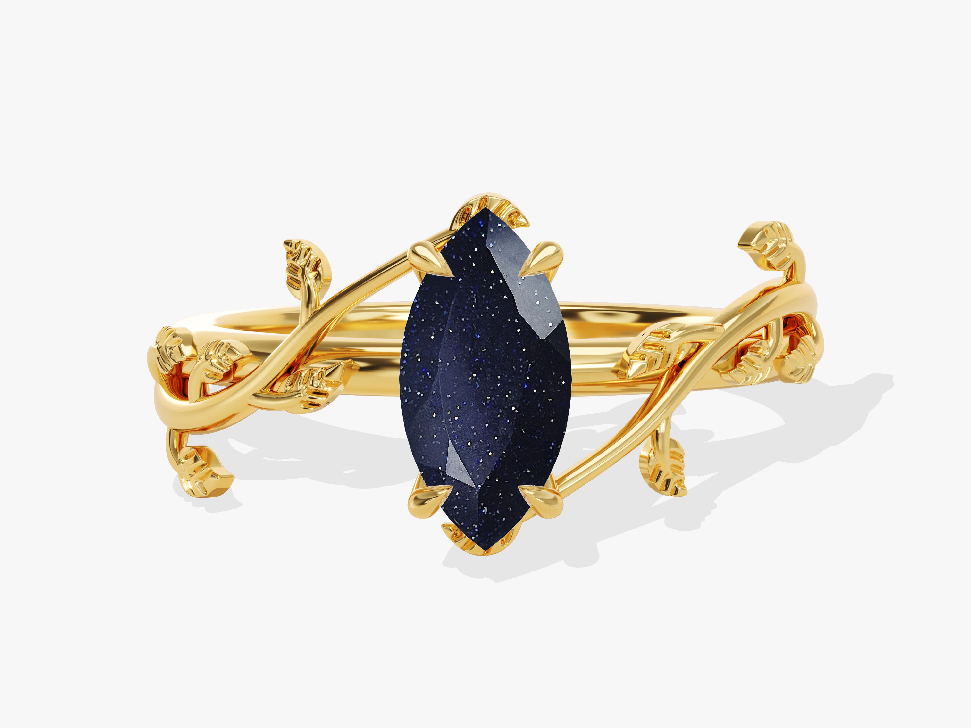Gold ring with marquise blue sandstone and leaf design