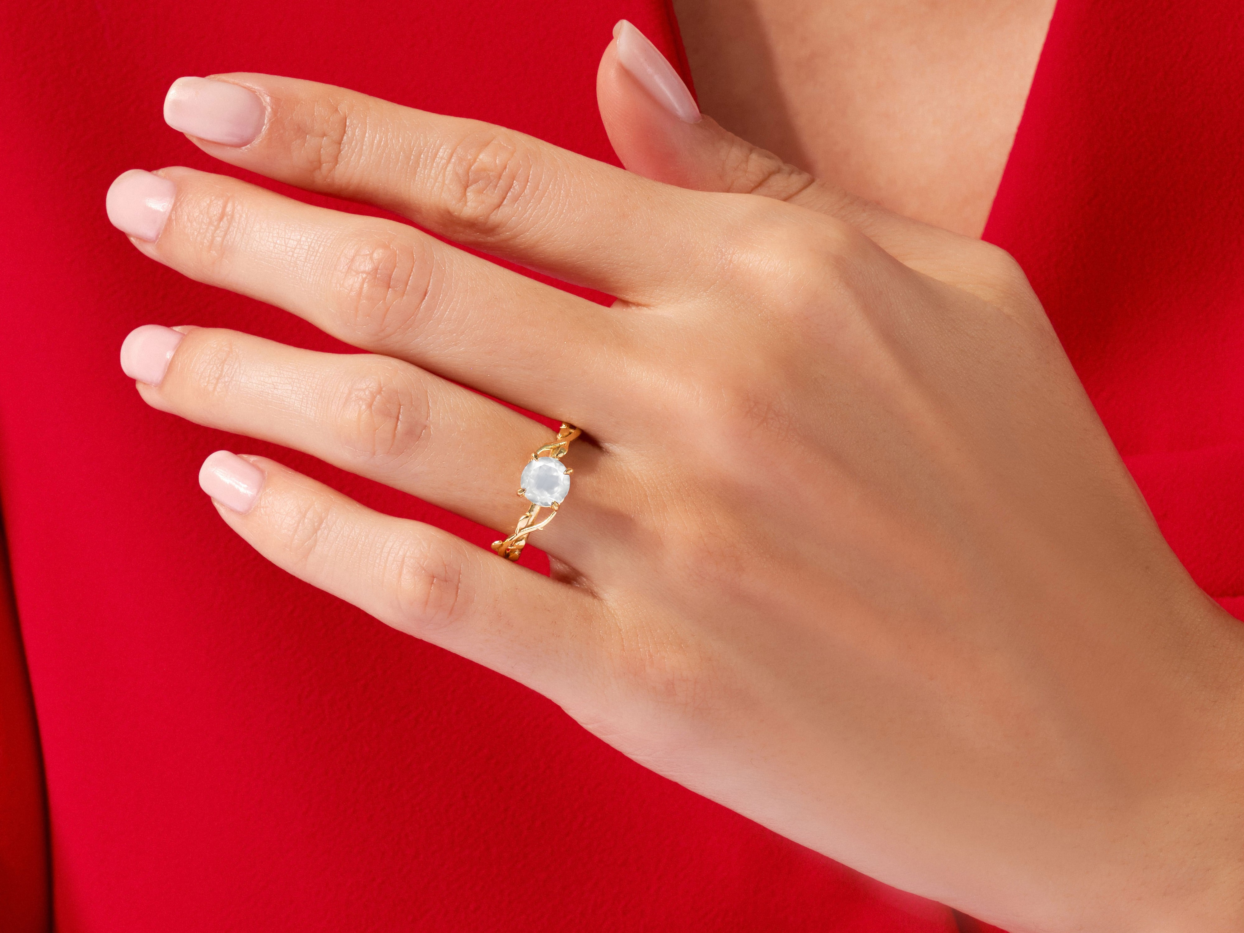 Gold ring with moonstone on hand, elegant jewelry