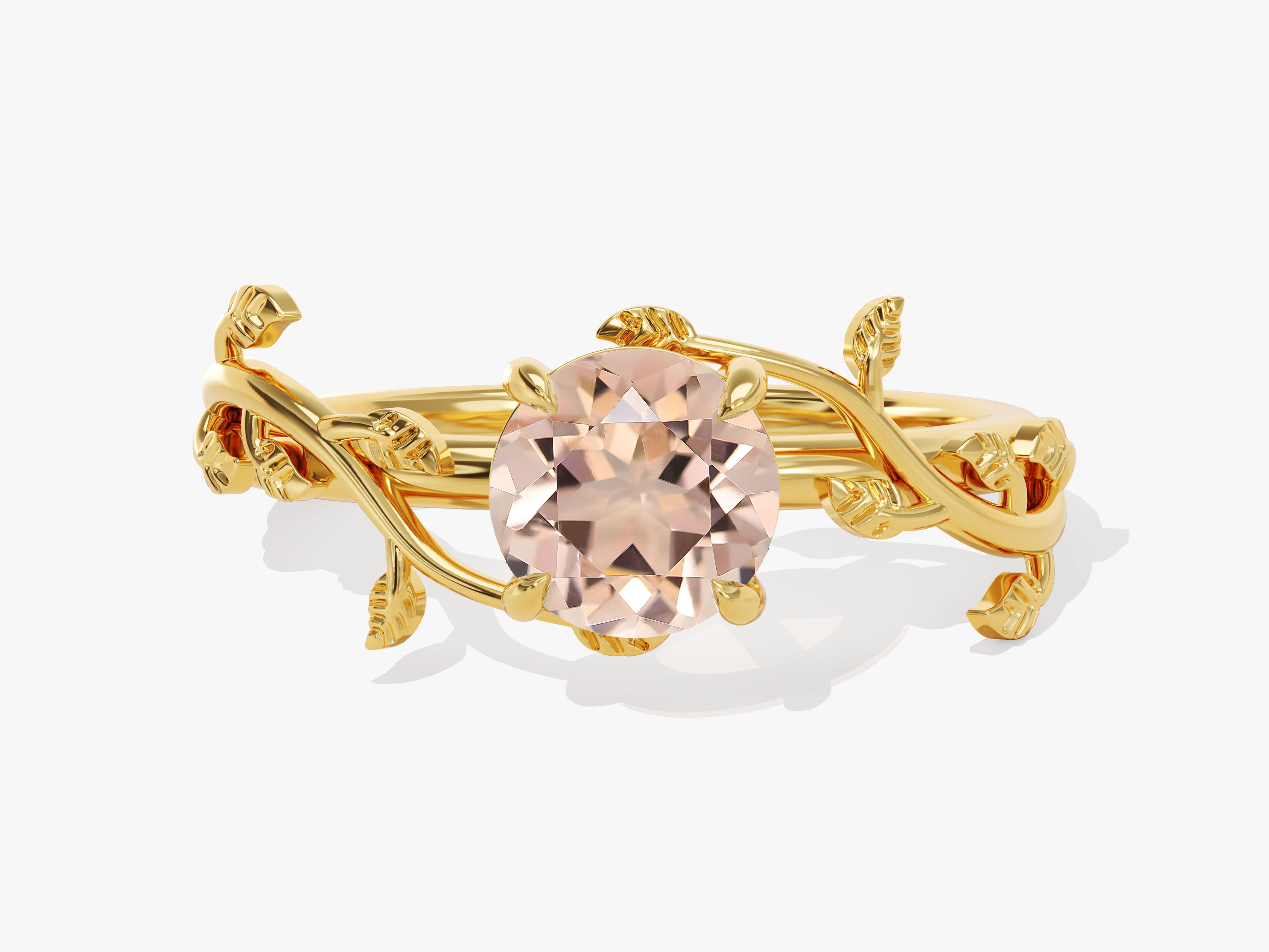 Gold ring with oval morganite and leaf design