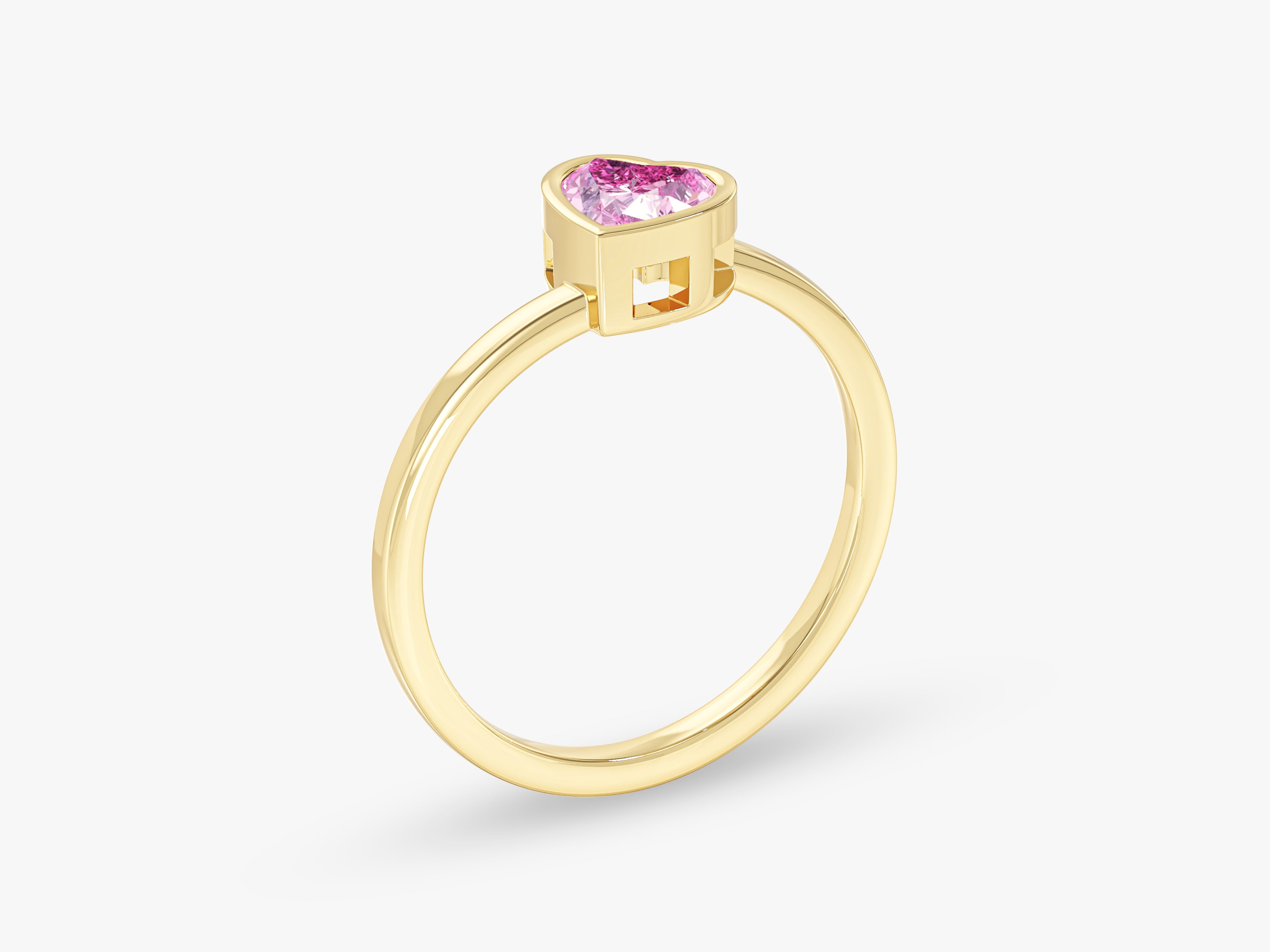 Gold ring with pink heart-shaped gemstone jewelry