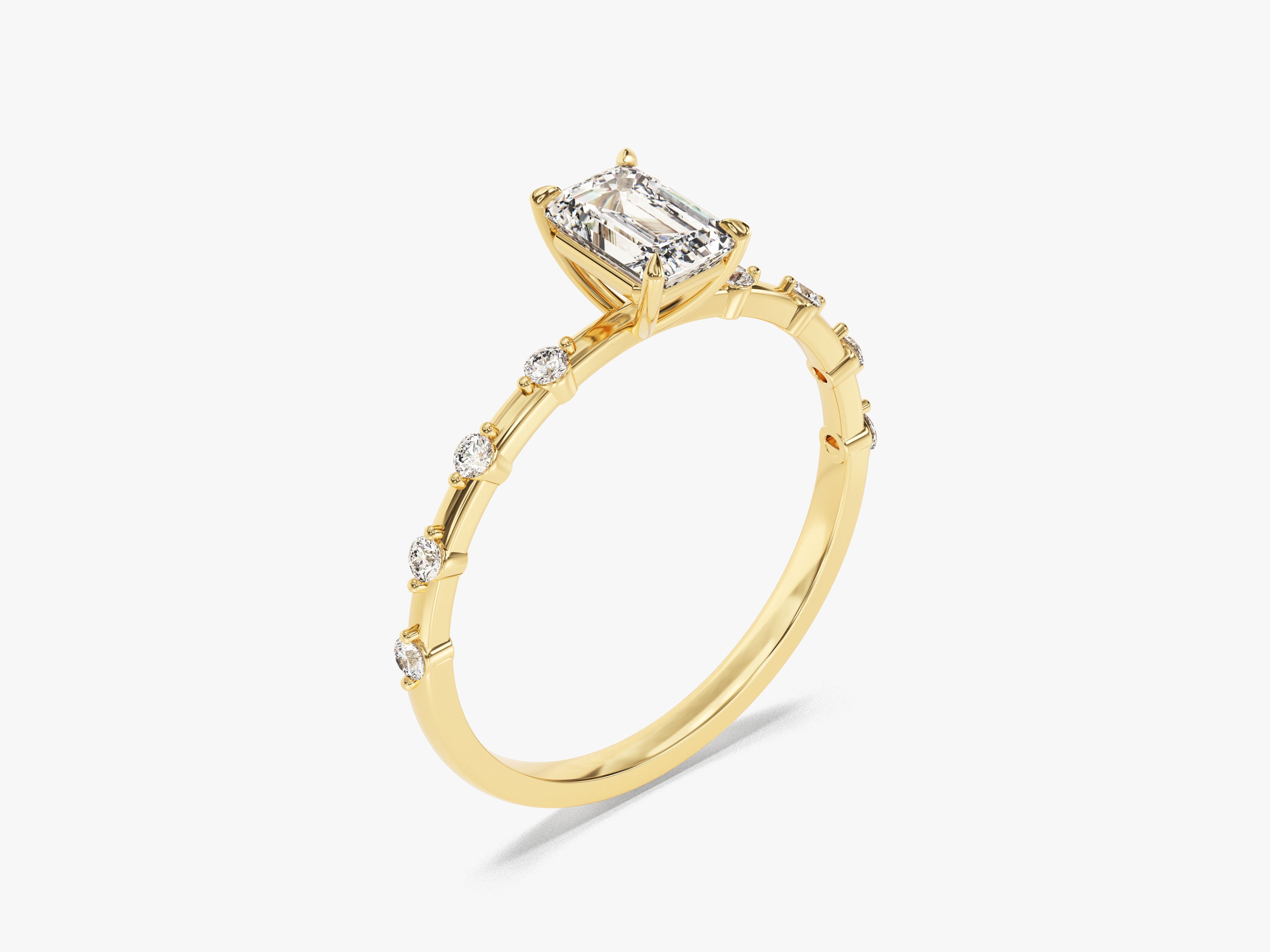 Emerald cut diamond engagement ring in yellow gold