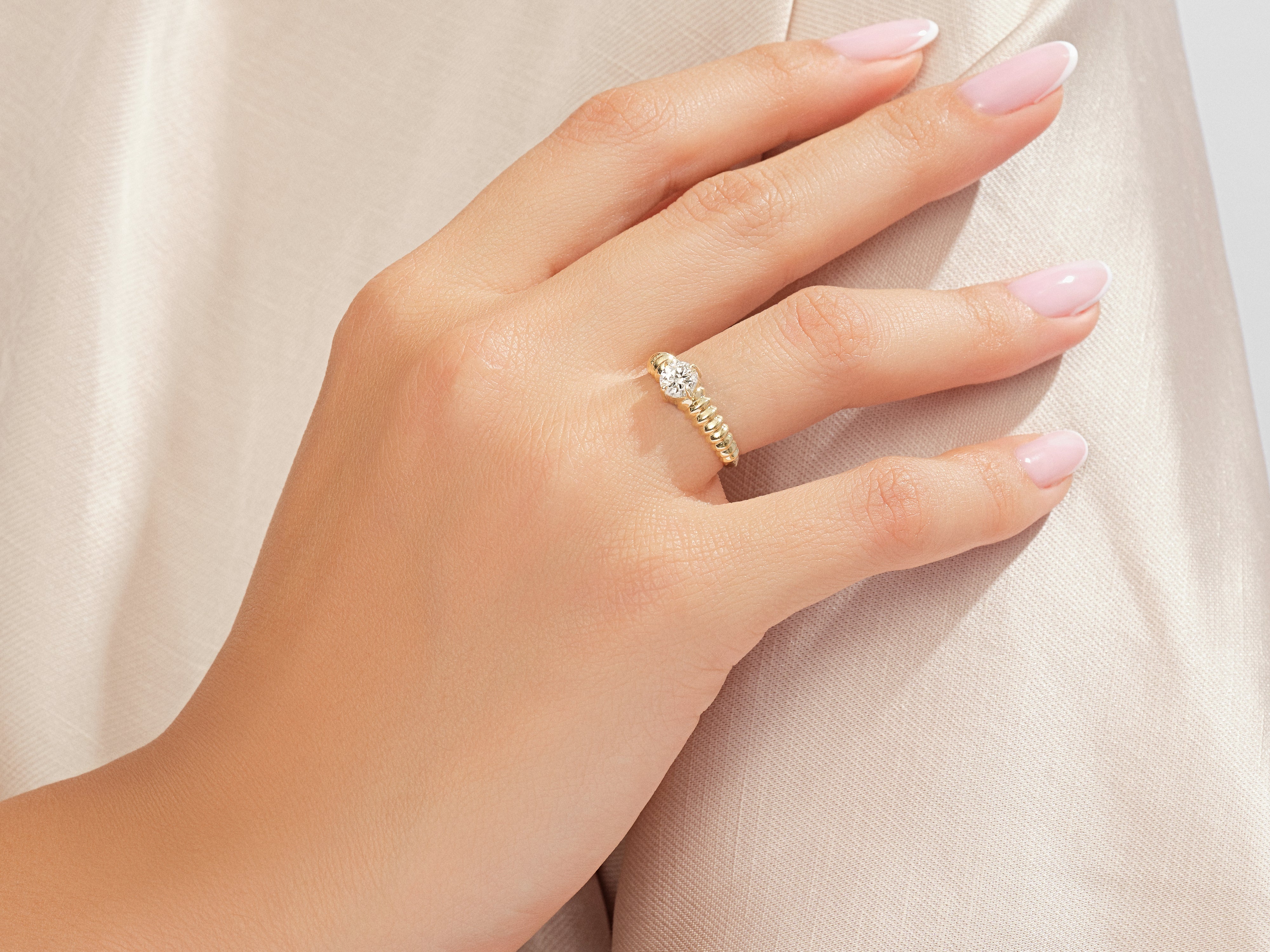Gold diamond ring on a woman's hand