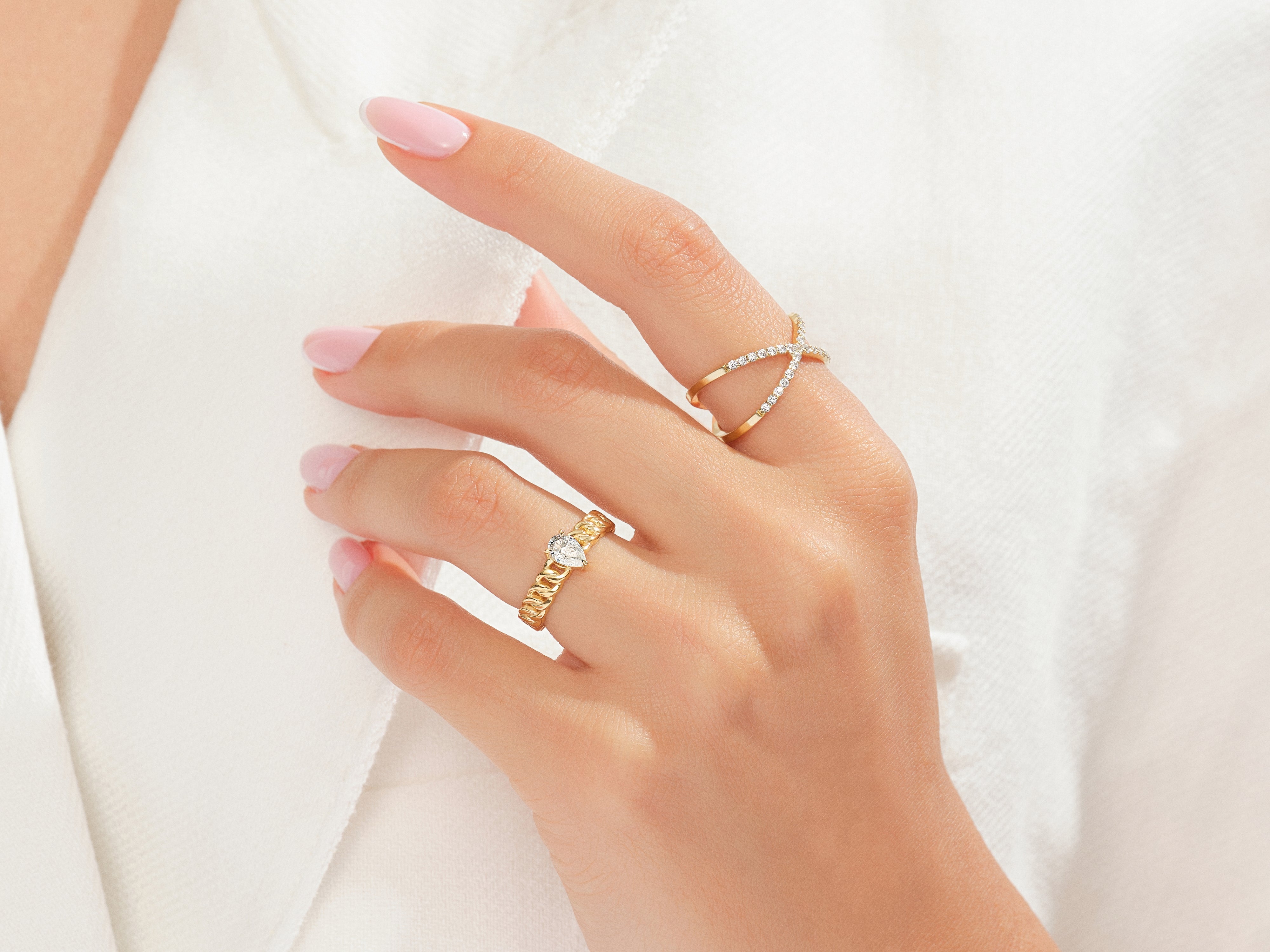 Gold diamond rings on a hand, jewelry photography