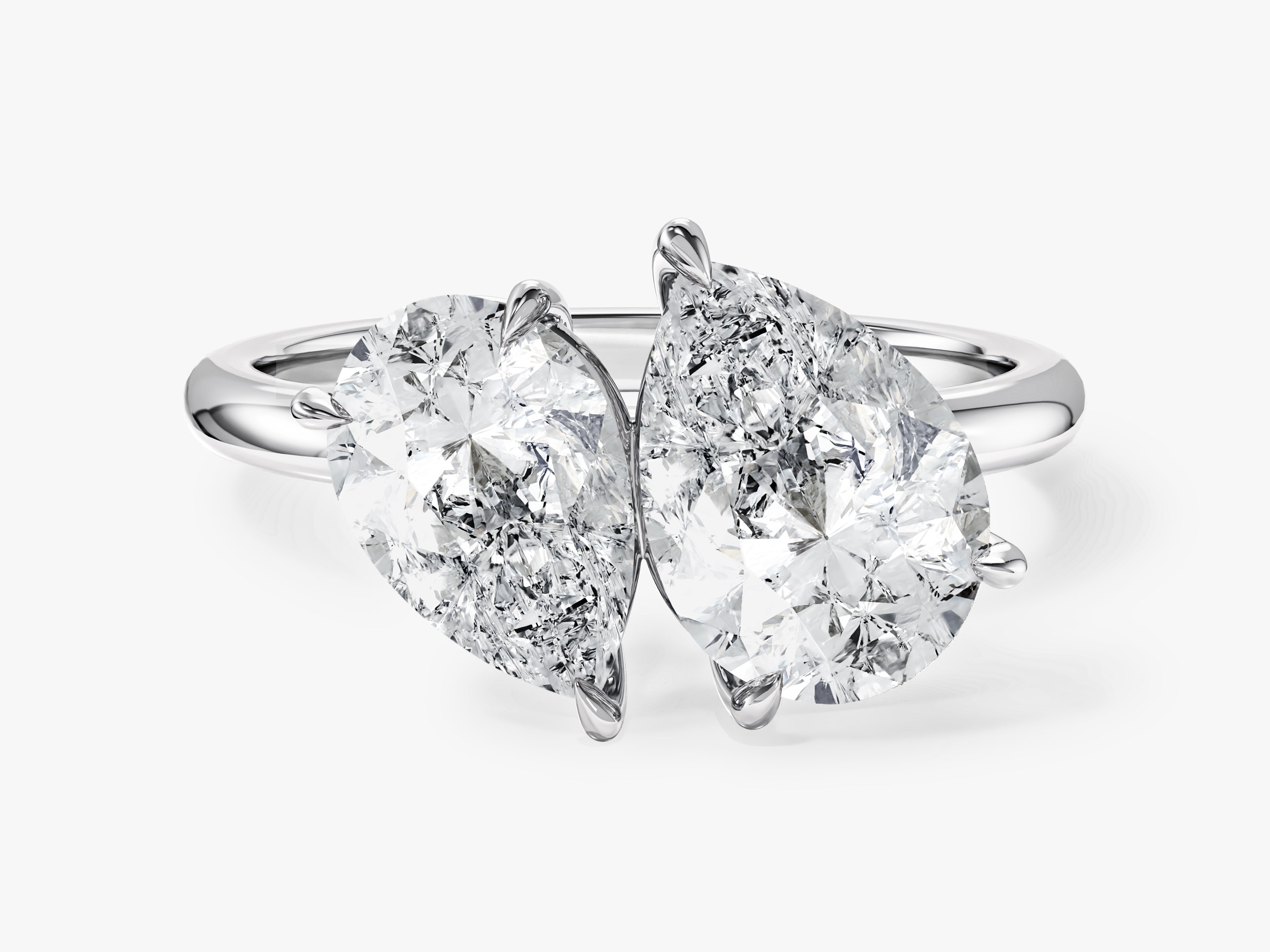 Two pear-shaped diamonds on a platinum ring
