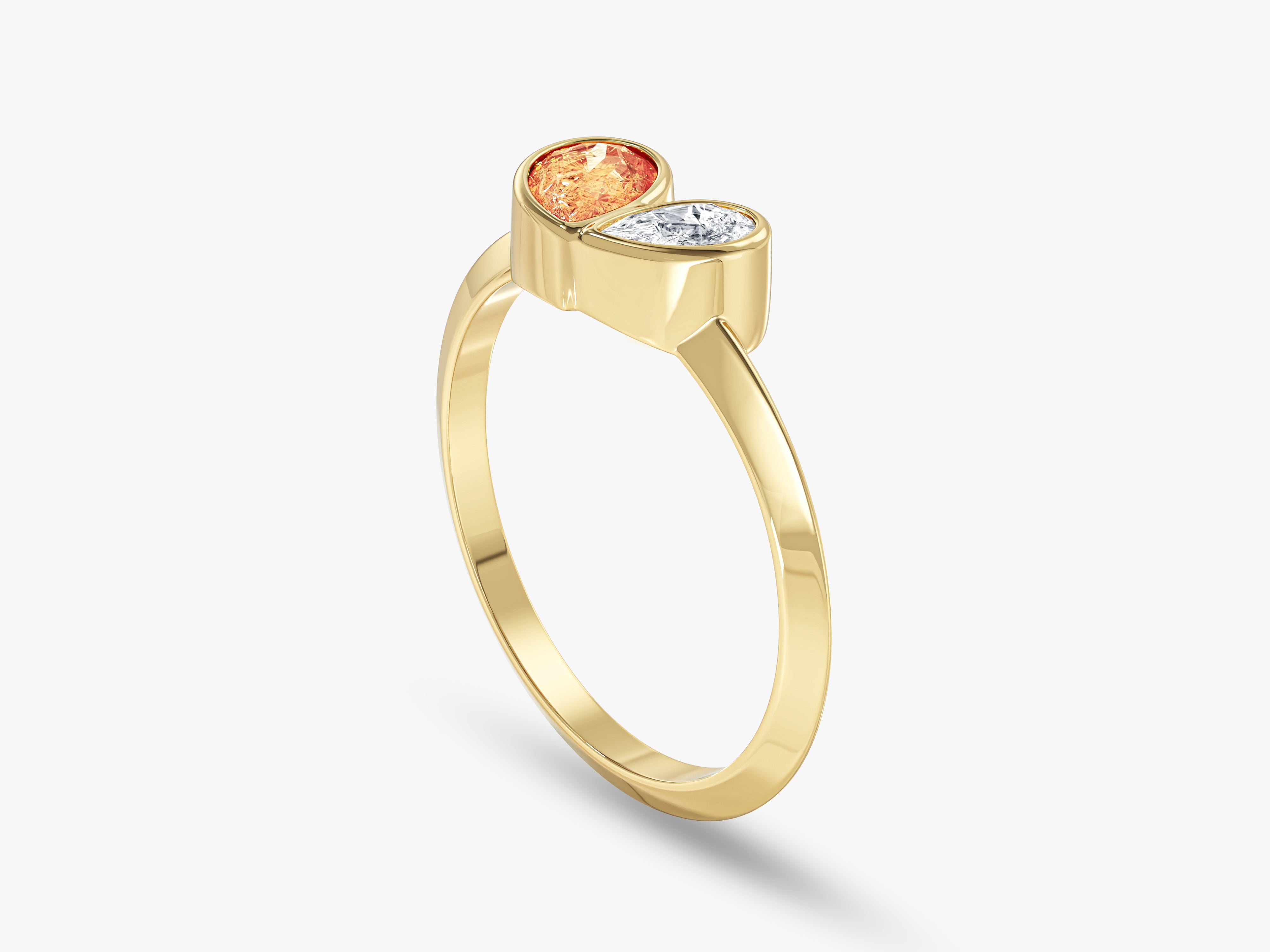 Gold ring with orange and white gemstones