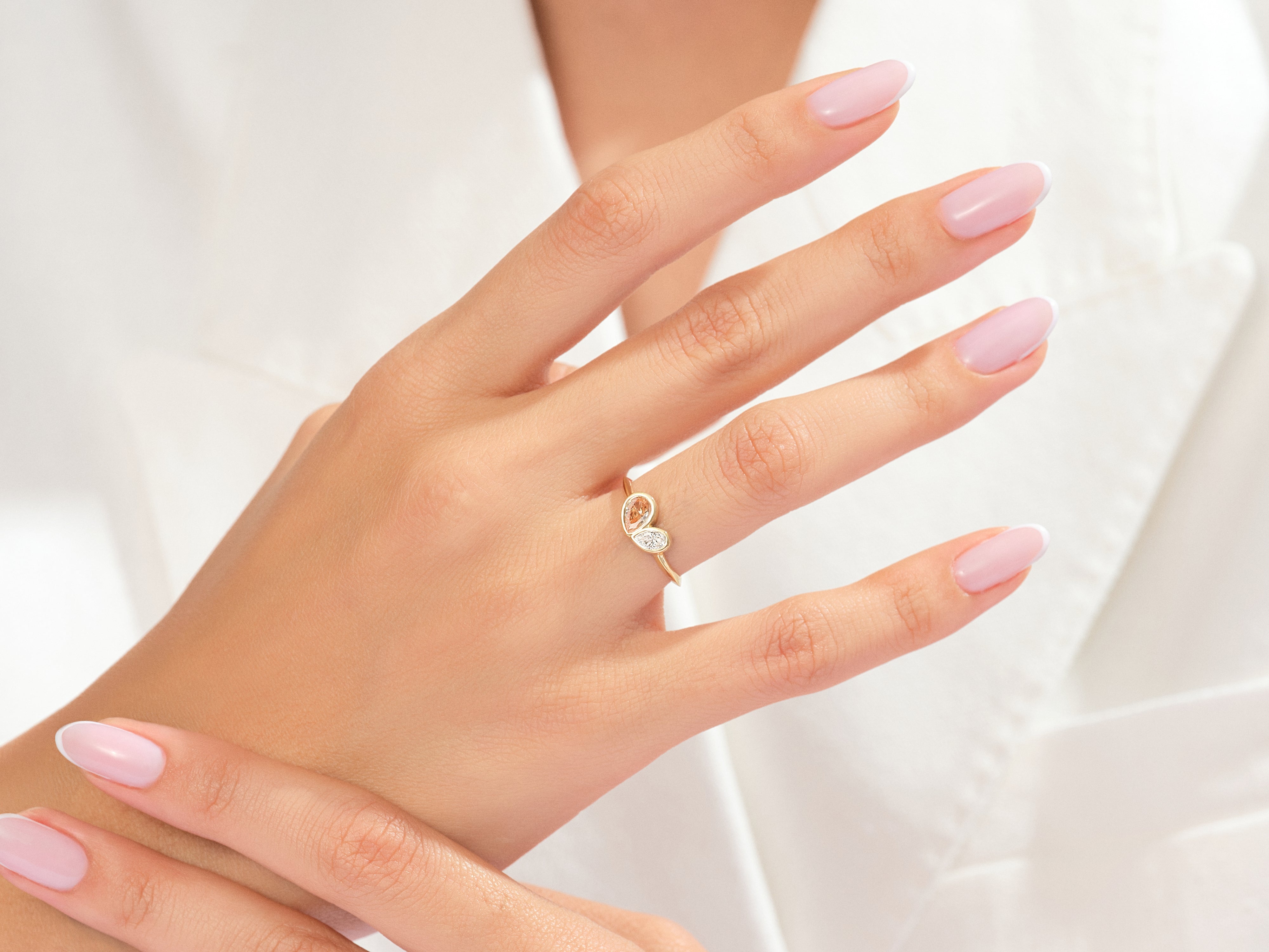Gold butterfly ring with diamonds on a woman's hand