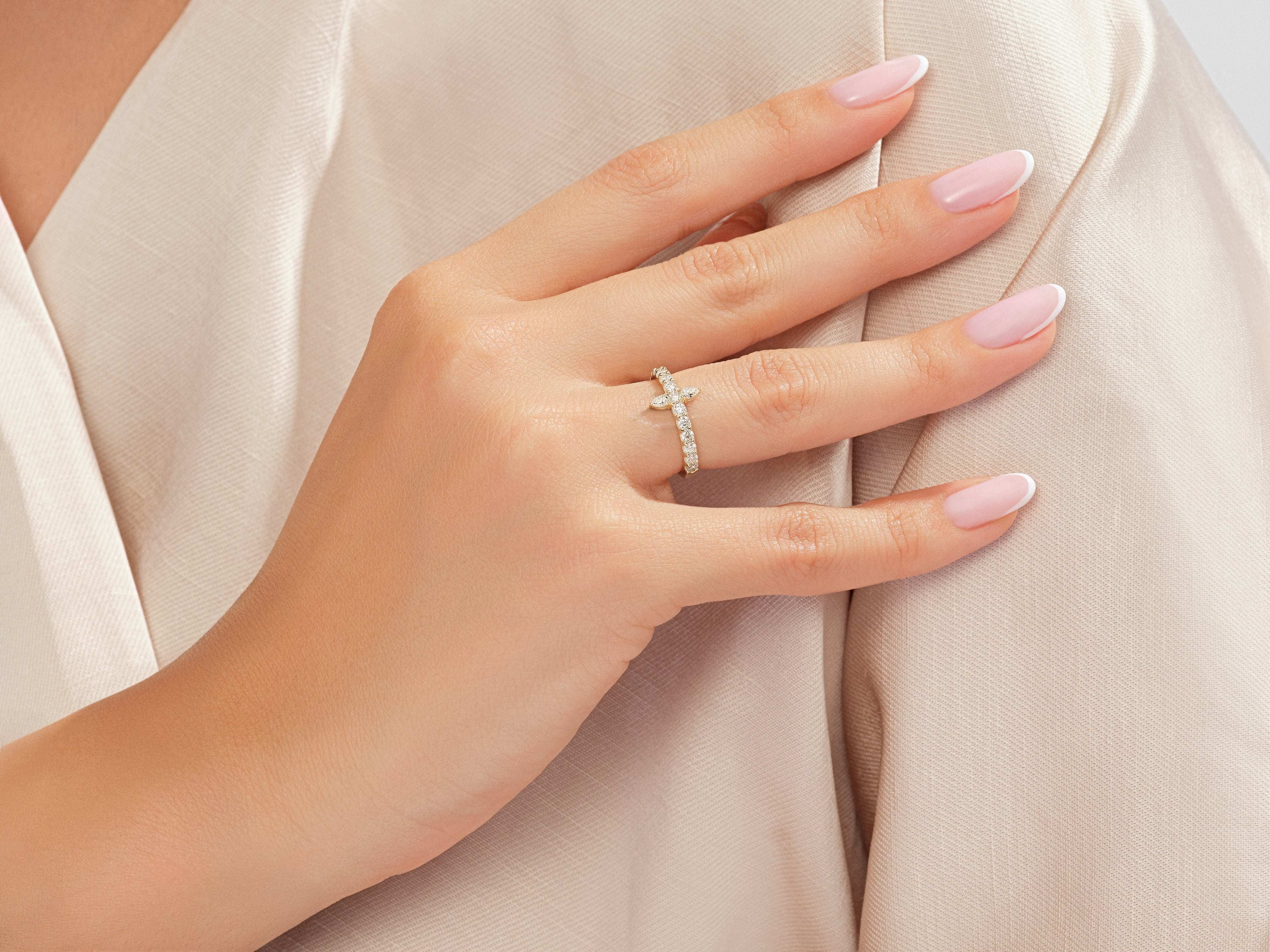 Diamond cross ring on a woman's hand, jewelry for sale
