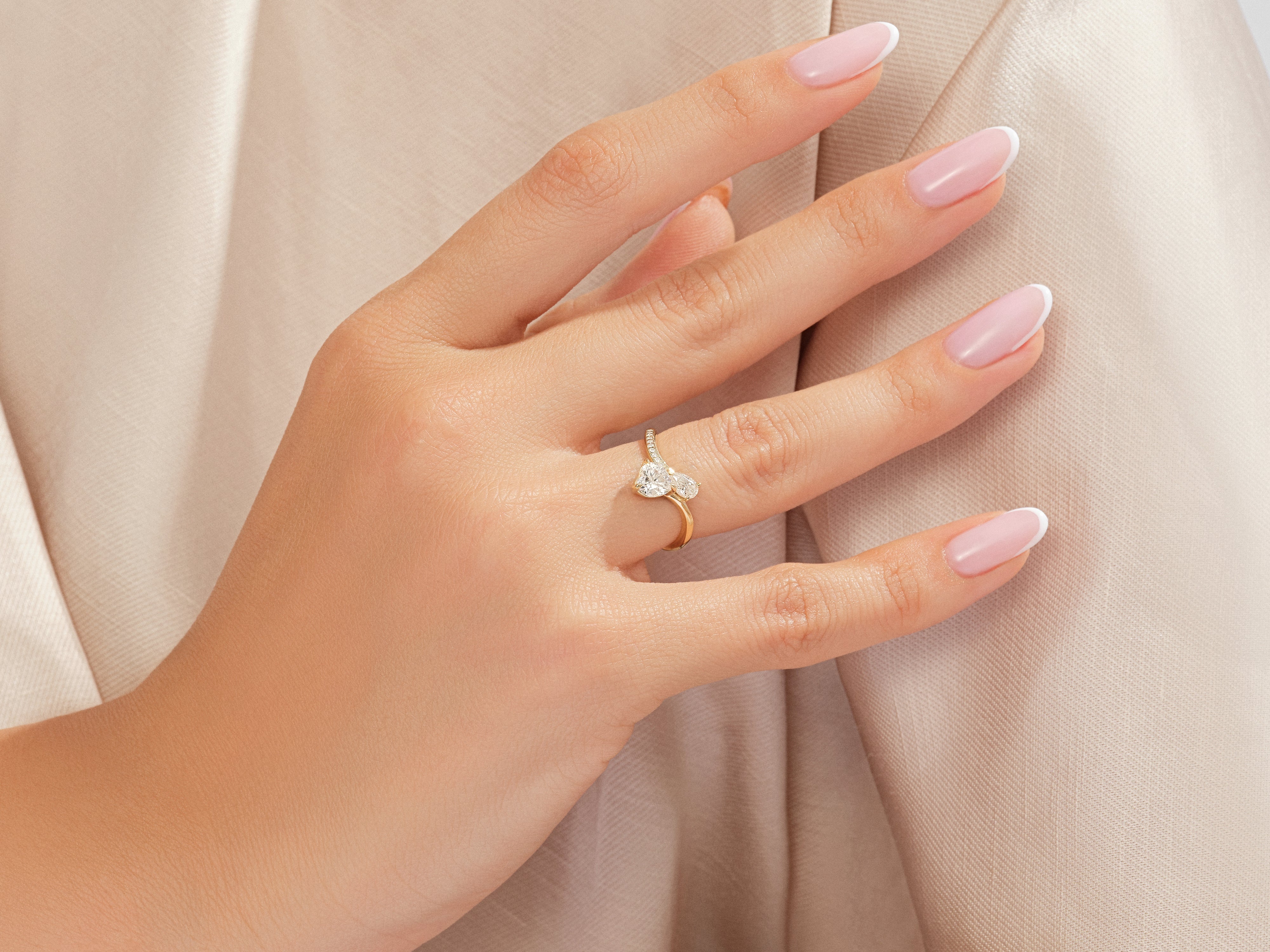 Diamond engagement ring on a hand, jewelry photography