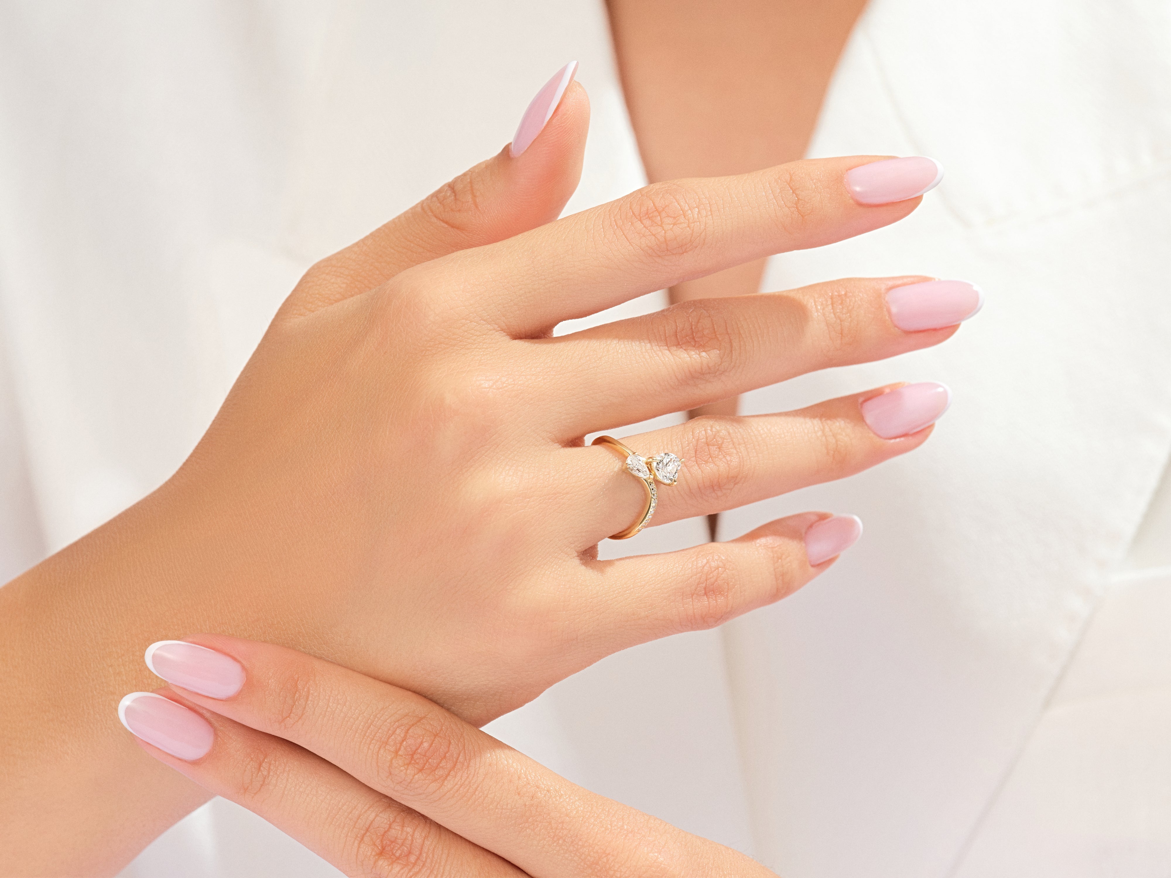 Gold ring with diamonds on a woman's hand
