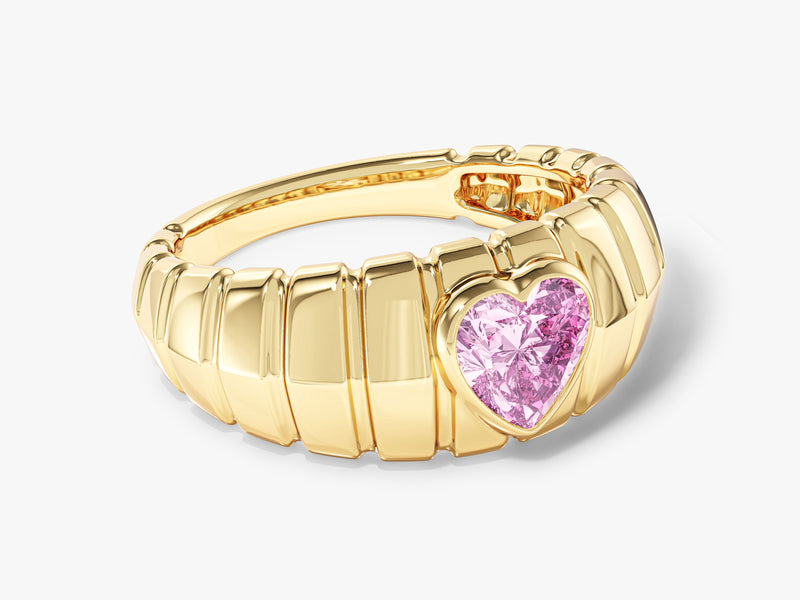 Gold ring with pink heart-shaped gemstone, jewelry design