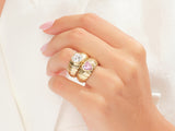 Gold heart rings with diamond and pink sapphire on hand